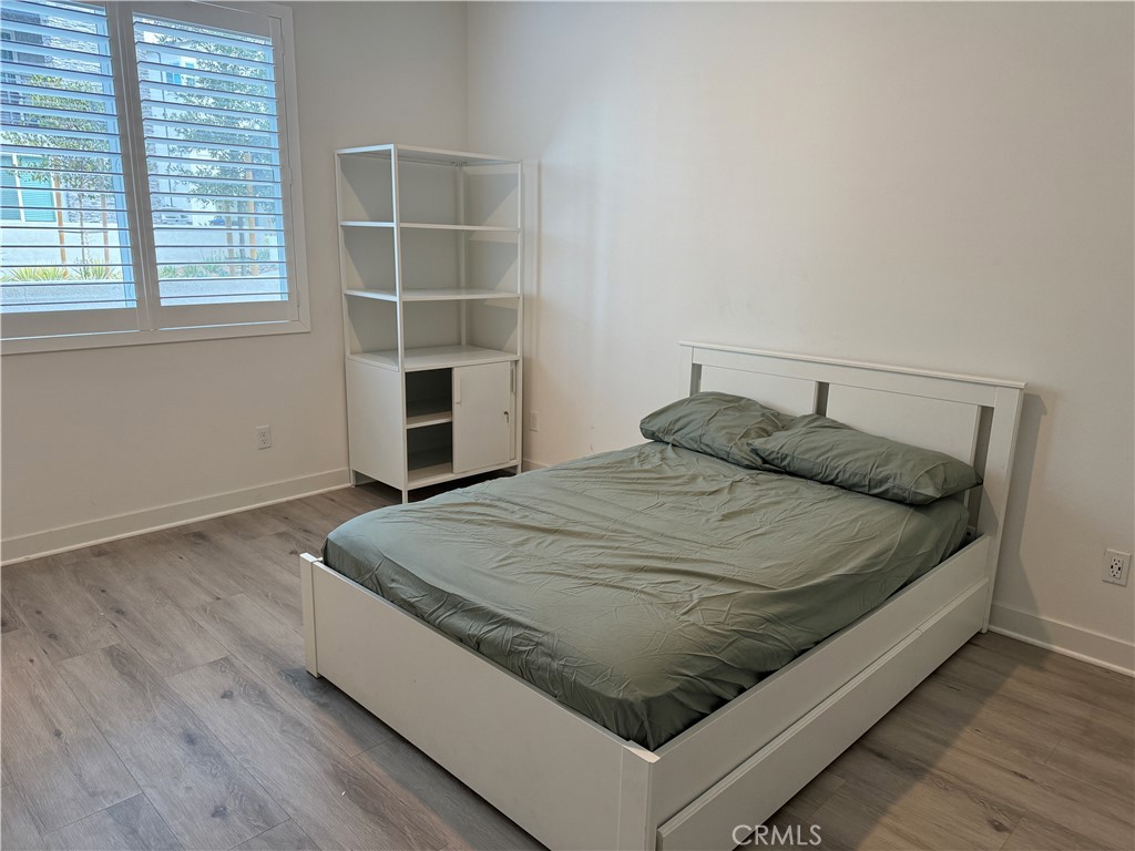 No pet. Female roommate only. A private ensuite bedroom on the ground level furnished (11'x15') for Rent in the Solis Park of the great park. Bathroom size 9' x 9'. In total 246 sqft in total. The room is on the first floor near the main entrance and includes a full size bed and a study table. the landlord may supply a small fridge and a lock for extra privacy. This room comes with hardwood flooring, Led lighting, and wood plantation shutters, and a closet. The washer and dryer are shared with the household on the second level. This space is ideal for a student or a busy professional who doesn’t need much kitchen access—heating food is okay or simple cooking. The Great Park residents have access to eight community parks, eight main swimming pools, numerous spas, and even an 8-lane competition pool at The Pools Park. Month-to-month rental contract (long term preferred).