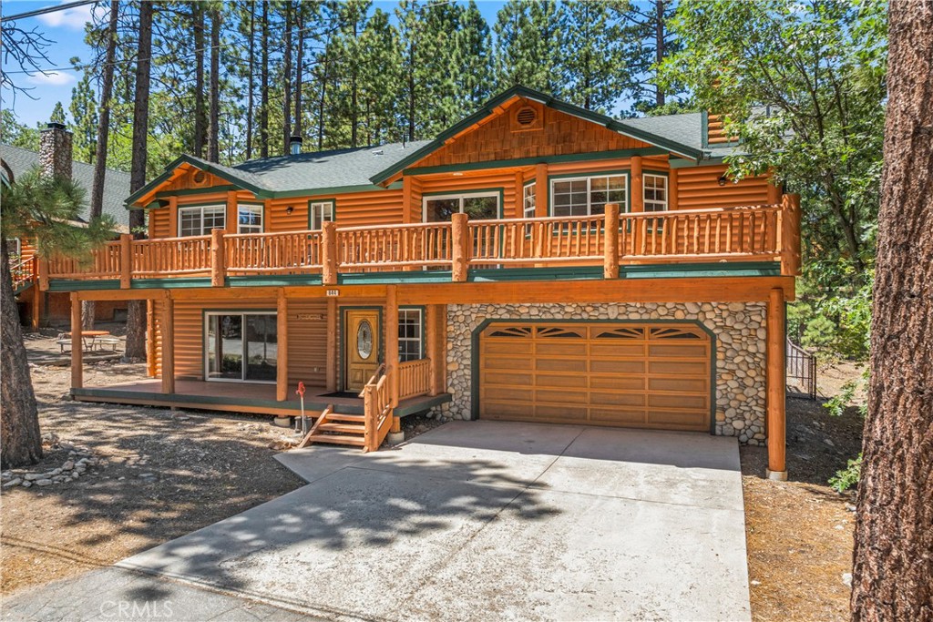 Your Mountain Escape Awaits – Just Minutes from Snow Summit and Bear Mountain!
This beautifully maintained log-style home delivers the ultimate Big Bear lifestyle—whether you're looking for a full-time residence, vacation getaway, or short-term rental investment. Ideally located less than 5 minutes to Snow Summit and Bear Mountain, this 3-bedroom, 3-bathroom home offers 2,409 sq ft of spacious, versatile living.
Step inside to discover a light-filled Great Room with soaring vaulted tongue-and-groove ceilings, a cozy stone fireplace, and direct access to an oversized front deck—perfect for morning coffee or evening gatherings. The open-concept kitchen is designed for entertaining, featuring granite countertops, stainless steel appliances, a custom range hood, and a large breakfast bar. A convenient door leads to the back deck and fully fenced yard—great for pets, kids, or just relaxing in nature.
Downstairs, you'll find a HUGE game/media room that’s a total showstopper—complete with a 75” cinema-style TV, pool table, arcade game, stone fireplace, and a full bathroom. It’s the perfect space to entertain or unwind after a day on the slopes.
Other features include:
* Oversized attached 2 car garage with space for all your mountain toys
* Level parking and covered entry for easy, year-round access
* Updated flooring and fresh, mountain-style finishes throughout
* Spacious decks and a large yard - ideal for BBQs and outdoor fun
Most furnishings are negotiable, so you can move right in and start enjoying mountain living from day one.
This is more than just a home—it’s a lifestyle. Don’t miss your chance to own a slice of Big Bear paradise!
