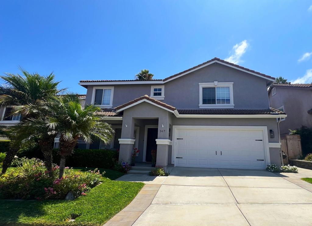 Welcome to 367 LA PURISMA WAY, a meticulously maintained home in the highly desirable community of Mission Terrace in Oceanside. This home features a spacious and functional floor plan, with luxurious upgrades throughout. Enjoy 3,103 sq. ft of living space complete with 5 bedrooms and 3 full baths, including a functional first-floor bedroom with a full bath, perfect for hosting guests or setting up a home office. The gourmet kitchen features a grand island with breakfast bar seating, a wine fridge, a Samsung Family Hub Smart Refrigerator, and a large walk-in pantry. The kitchen flows through a casual dining area into a spacious family room. The second floor is home to a sizable laundry room, a generous primary suite with two walk-in closets, 3 additional bedrooms each with their own walk-in closet and another full sized bathroom. The largest of these bedrooms can also be used as a bonus room. The gorgeous backyard is a tropical oasis with a modern twist. Set on one of the largest lots in the neighborhood, the oversized pool with built-in hot tub will provide endless days and nights full of entertainment and relaxation. The sports enthusiasts of the family will make the most of the expansive backyard with both a basketball hoop and built-in soccer goal/golf net with driving mat. In the evening, you can gaze up at the stars while listening to the tranquil sounds of the serene waterfall. The backyard is also home to an abundance of delicious fruit trees on the back slope, including lemons, limes, oranges, plums, peaches and avocados. It is so spectacular, you will never want to leave home. However, if you do occasionally choose to leave your private paradise, you’re just a short drive away from multiple schools, churches and grocery stores. Conveniently located near Camp Pendleton, the area is home to many desirable Southern California gems including Temecula Wineries, Legoland, the Mission San Luis Rey, the Iconic Oceanside Pier and gorgeous North County beaches. All of this comes with the conveniences of PAID SOLAR, No Mello-Roos, low HOA dues, a Salt Water Softener, an EV Car Charger, and dual climate air conditioning units. Don’t let this dream home slip away! You too can live like you’re on vacation every day!