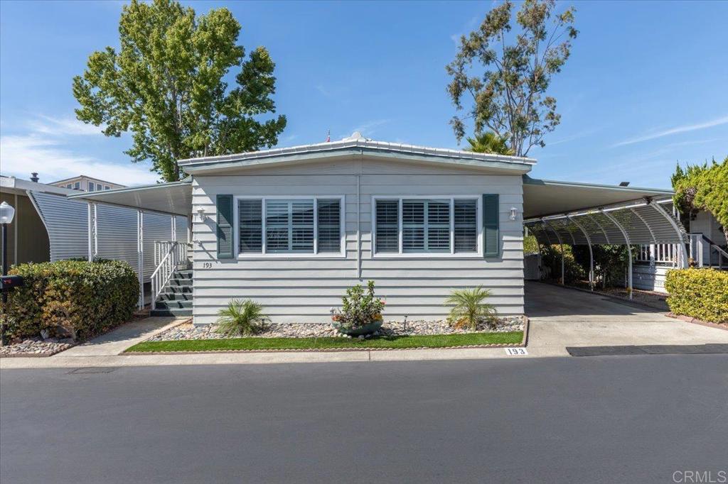 Beautiful, updated home that shows pride of ownership, located in a 55+ resort style community offering many recent upgrades, including: LVP floors throughout, remodeled Kitchen, updated Bathrooms, drywall interior, new interior doors & hardware, shutters, vinyl dual pane windows throughout (except bathrooms), both bedroom closets have been re-finished by Closet World, turf back yard that is great for pets, newer A/C, newer furnace, newer tankless water heater (all three replaced in 2017), and so much more! Some of the features of the new Kitchen include a new added pantry, newer appliances & farmhouse stainless steel sink, & deep pot pull out drawers. Separate Living and Family room, plus a large California room, offer lots of Living space plus plenty of extra space for an office & hobbies. The widened carport w/ privacy slats plus 2 storage sheds give ample space to park your vehicles and work on outdoor projects! Monthly space rent is $689.33.