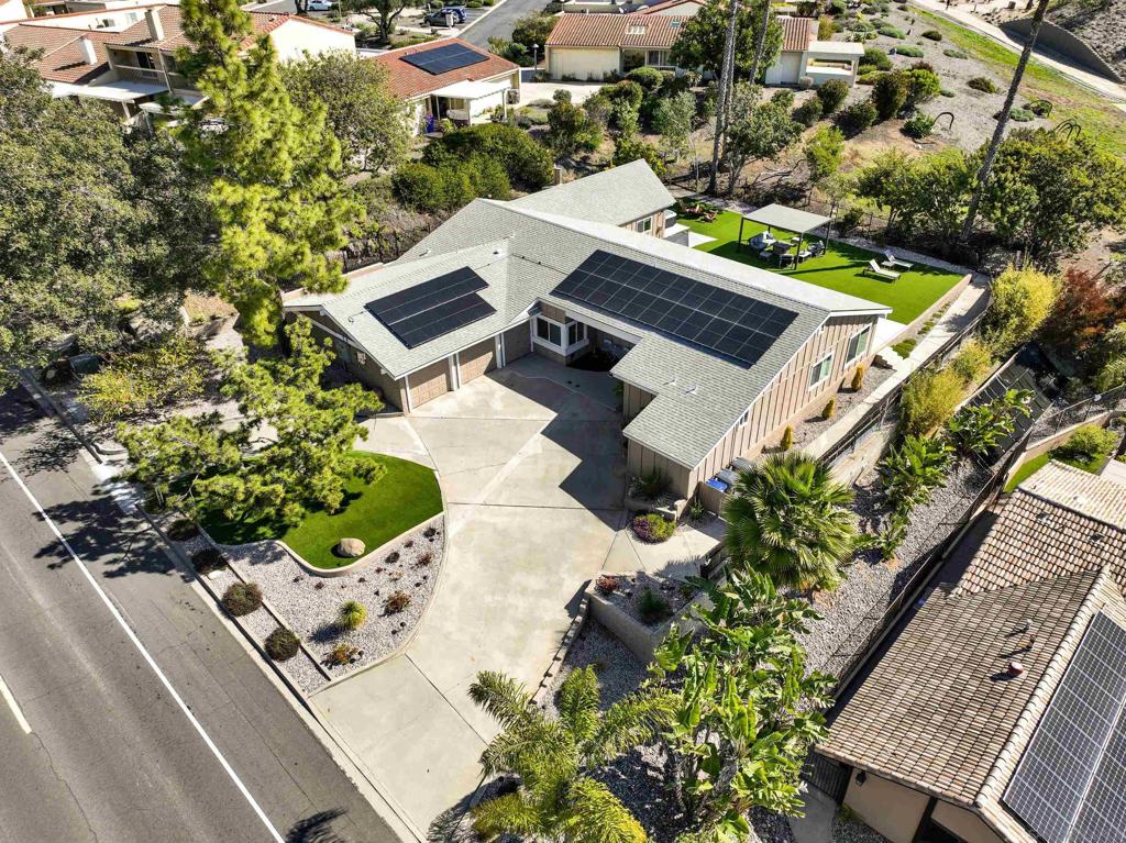 Spectacular fully remodeled Single-Story with Panoramic Views in Stoneridge! Perched on a spacious ¼-acre lot, Designed with exquisite attention to detail.This stunning property offers an expansive open-concept layout featuring 5 large bedrooms and 4 luxurious full bathrooms, including 3 private master suites. Step into elegance with a sleek chef’s kitchen boasting custom matte black cabinetry, striking quartzite countertops, and high-end brand-name appliances. The bathrooms are thoughtfully finished with premium luxury materials, providing a spa-like experience throughout.New 5-ton A/C system,Energy-efficient Milgard vinyl windows and sliding glass doors,400 AMP electrical panel,Complete repiping and additional sewer line, new electrical, New composition shingle roof,PAID OFF solar system. Enjoy indoor-outdoor living at its finest with two large sliding doors opening to a spacious backyard—perfect for entertaining, relaxing by the fire pit, or simply taking in unmatched sunset views and 4th of July fireworks right from your own private retreat. This home truly captures the essence of quintessential Southern California living.
