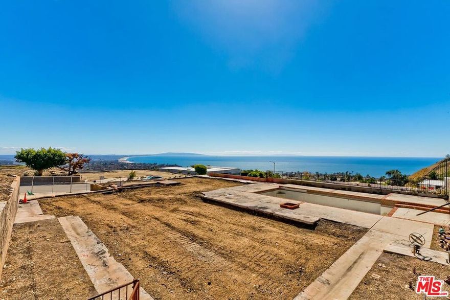 Located in Marquez Knolls with exceptional ocean, city and hillside views, this large parcel of land presents an opportunity to contribute to the area's resurgence following the Palisades Fire. This was one of a few select lots chosen by Mr. Lachman for his model homes when he originally developed the area. Perfectly situated with panoramic ocean views from much of the property, plus added benefits such as: views of the LA basin allow for enjoyment of 4th of July fireworks, fruit trees on the hillside above, and a backyard offering privacy and occasional wildlife sightings. Just minutes from the Palisades Village, future residents will enjoy effortless access to boutique shopping, acclaimed dining, and everyday essentials all within a peaceful, scenic environment. As the community rebuilds and renews, this property stands as a symbol of resilience and opportunity. Don't miss your chance to create your dream home in one of Southern California's most prestigious coastal enclaves. Original pool still exists. Phase 1 and Phase 2 have been completed. Neither Seller nor Broker/Agents guarantee the accuracy of the square footage, lot size, permits or other information concerning the conditions or features of the property. Buyer is advised to independently verify the accuracy of all information (including square footage) through personal inspections and with the appropriate professionals. See DOCS for Offer Guidelines.