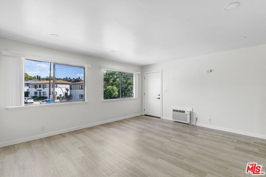 Price listed, $2,495, is the net effective rent reflecting a $2,400 concession on a 12-month lease (Market rent = $2,695). This is based on approved credit/application. Welcome to your freshly renovated two-bedroom corner unit! Perched on the upper level, this bright home offers modern upgrades and comfort. Step inside and be greeted by light-filled living spaces featuring new finishes, ceiling fans, and a wall AC unit to keep you cool year-round. The updated kitchen is equipped with stainless steel appliances, including a refrigerator and gas stove, and has plenty of space to whip up your favorite meals. Just around the corner, you'll find your in-unit washer and dryer, so no more late-night laundromat runs. Both bedrooms are spacious and airy, each with ceiling fans for added comfort. The renovated bathroom features fresh, modern touches and a shower-tub combo to unwind after a long day. When you're ready to relax outdoors, take advantage of the shared pool for a refreshing dip. Keypad access adds peace of mind, and you'll also have one parking space included plus additional shared coin-op laundry on-site if needed. This bright corner unit is move-in ready. Don't miss it!