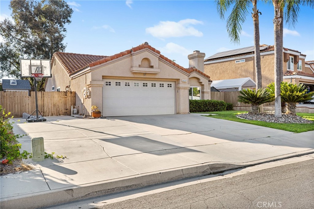 Located in the highly sought-after Murrieta Valley Unified School District, this beautifully upgraded single-story home offers exceptional value and versatility. With no HOA, low property taxes, and a host of desirable features, this property truly stands out. Step outside to find dedicated RV parking with full hookups, including 50-amp service—ideal for adventurers or guests. Plus, enjoy the flexibility of an 8x15 ADU complete with lofted ceilings, skylights, electrical and a mini-split HVAC system—perfect for a home office, creative studio, or private guest suite. Inside, you'll appreciate the seamless open-concept layout connecting the living, dining, and kitchen areas. The recently renovated kitchen boasts brand-new cabinetry, sleek quartz countertops, stainless steel appliances, an oversized sink, and ample storage—perfect for those big Costco runs! Tile flooring flows throughout the main living areas, complemented by vaulted ceilings and new dual-pane windows and doors that flood the space with natural light. Solar panels help keep the home energy-efficient—cool in the summer and cozy in the winter. The secondary bedrooms are generously sized, with one offering direct access to the backyard via a sliding door. The shared bathroom includes an updated vanity and a large jetted soaking tub, ideal for relaxing after a long day. Retreat to the spacious primary suite, featuring wood-look tile flooring, dual closets, private access to the backyard, and an en-suite bathroom with granite countertops and a shower/tub combo. Out back, you'll find a large covered concrete patio, grassy play area, raised garden beds, and even room for a pool—all backing up to a peaceful walking trail for added privacy and tranquility. Don't miss this opportunity to own a versatile, move-in-ready home in one of Murrieta's most desirable neighborhoods—and all at an affordable price!