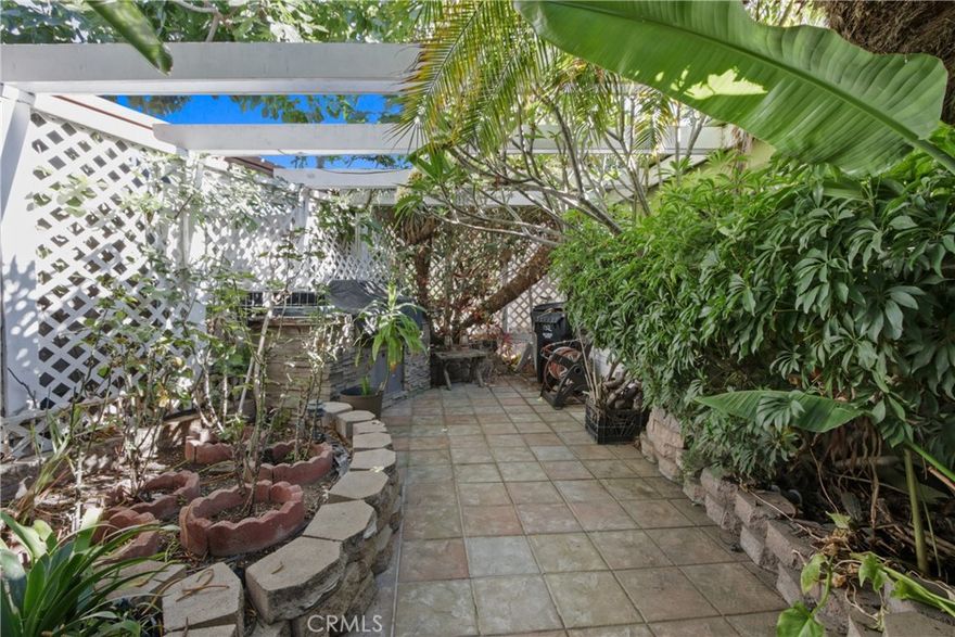 MAKE AN OFFER!!!!LOWER PRICE & RENT! THIS HOME IS UNLIKE ANY OTHER HOME! A MUST SEE! A ground-level residence, no stairs. Its oversized lot is spacious with a quaintly fenced-in yard featuring a built-in fountain, gas BBQ, grass, &  beautiful trees that offer shade & privacy. Built in 1995, this 1782 sq ft home (1,982 counting attached storage in the garage) it offers a well-designed layout with 3 bedrooms & 2.5 bathrooms, a family room,  a formal living room with a stunning gas-burning fireplace of stucco/tile with a mantle-to-ceiling mirror, bringing warmth & depth to the room.  The formal dining area is adjacent to the formal living area with a pass-through space between the dining room and kitchen.  The open floor plan creates a seamless flow throughout the home, enhanced by abundant natural light pouring in through multiple skylights & generously sized windows. The kitchen is spacious enough for multiple helpers during special occasions, & island is large enough for seating at the end. Adjacent to the kitchen, the family room provides ample space for an additional dining area as well as plenty of space to relax as a family. All 3 bedrooms are generously sized & have walk-in closets. The 1st & 2nd bedrooms are connected by a Jack & Jill bathroom, & include a stall shower with a sitting bench. The 2nd bedroom features double doors & a custom-built-in workstation (which can be removed if desired). The primary suite is generously sized, with a separate walk-in closet just off the primary bath, which includes a Roman-style tub & a separate stall shower.  Additional features of this home include two skylights with retractable blinds in the family room, a laundry room with a half bath, 2 water heaters,wood-look laminate flooring, water purification system, 6 security cameras, tube skylight, an automatic sprinkler & drip system, low-voltage accent lighting, A/C PLUS an extra window  A/C, & several free-standing plants. This home truly is a sanctuary—a must-see for anyone seeking comfort, style, & functionality.  This home is located at the prestigious Anaheim Shores Estates. This park is unlike other manufactured home parks as it offers so many benefits, such as extra-wide streets, it's pet-friendly, has well-maintained trees & shrubs, a community pool, spa,  bbq area, clubhouse, & a grass area for pets. The clubhouse offers a venue to enjoy many different occasions. They also have a billiards room, card game room, a library, a TV room, & a kitchen.