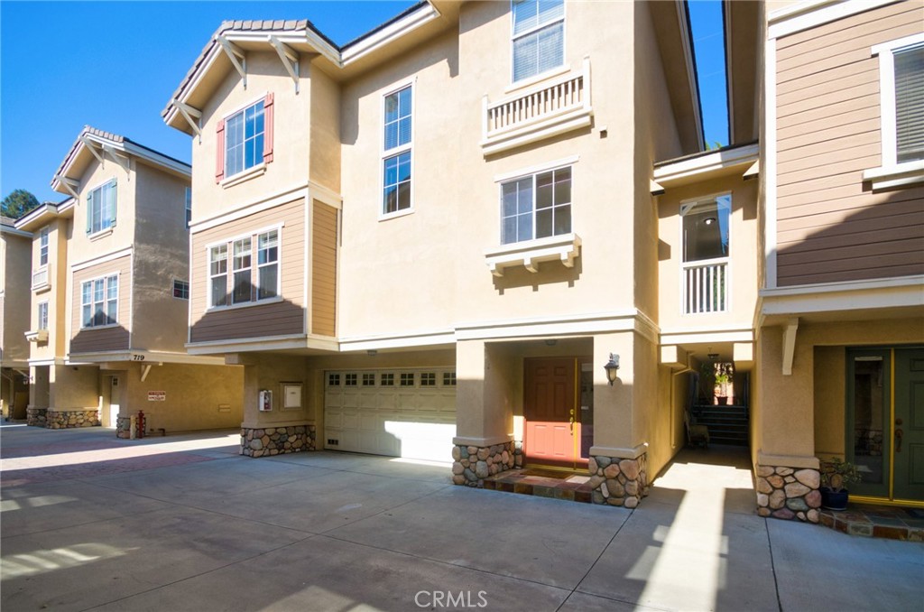 Location, location, location!! 717 Arcadia Ave #C is a sun-filled tri-level townhome tucked inside a gated community. Built in 2003, the 2,032 SF plan delivers 3 beds, 2.5 baths, a direct-access 2-car garage, interior laundry, and a bonus room perfect for an office, gym or playroom. The open main level boasts soaring ceilings, wood-look floors and a granite kitchen with cherry cabinets, stainless appliances and a walk-in pantry. A portion of the living room has been partitioned to create the bonus room (unpermitted). Easily reversible. A private, fenced patio just off the mid-landing extends your living space for coffee, pets or plants. Upstairs, the vaulted primary suite offers a walk-in closet, dual sinks, jetted tub and separate shower, while two secondary bedrooms share a full hall bath. Low HOA. Top-ranked Arcadia schools, Westfield Santa Anita, Park, fitness, supermarkets, shopping mall, and the 210 Fwy are all minutes away. Move-in Ready. Act fast—homes in this A+ spot rarely last!