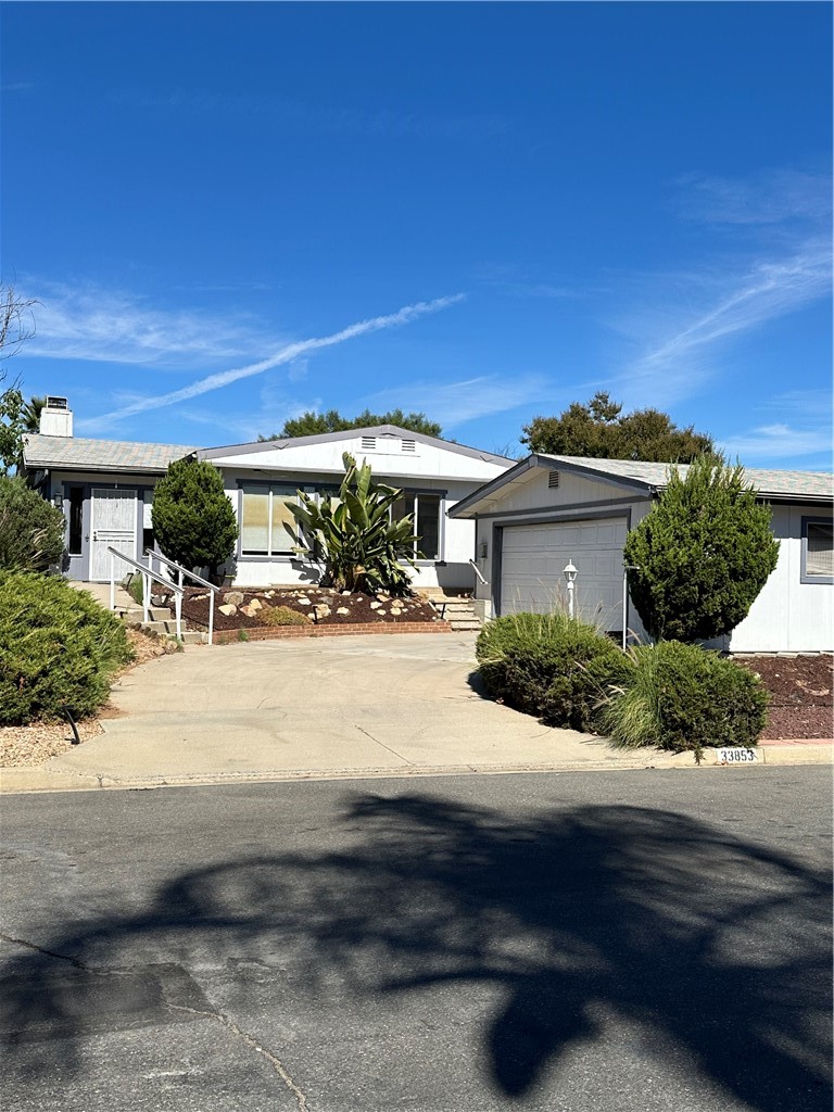 Great starter home or income property awaits in the lovely community of The Farm. This large triple-wide 2-BR manufactured home resides on a large lot that backs directly to an orange orchard where fruit is readily available to residents any time, fresh OJ every morning when in season. The kitchen was updated in 2017 but otherwise ready for you to customize to your preference. The sizeable low-maintenance lot conveys with the home, not on leased land like other parks. This large community with low HOA fees includes 600 Acres of Common Area includes 38 Acres of Citrus Groves, 3 Pools, 2 Spas, a Pond for Fishing (Catch & Release), Game Fields, a Basketball & Tennis/Pickleball Court, low-cost boat and RV Storage Areas, Hiking Trails, a Picnic Area and 2 Tot Lots. Enjoy easy access to the 15 and 215 freeways. Come see one of the last vestiges of affordability in this lovely community. Low-cost boat and RV STORAGE! @ 59$/mo