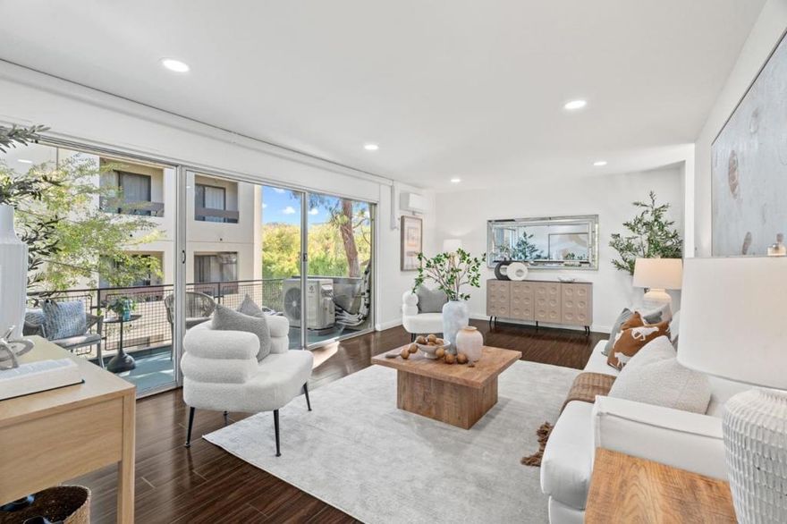 Blocks away from California Ave, minutes from Stanford, this updated end-unit is open & bright and is one of very few units in the complex with A/C system.  New mini-split units have been installed in each room with HOA approval and city permits providing both heating & cooling in addition to the radiant heating system.  Abundance of natural lights flow throughout every corner with floor-to-ceiling glass.  Spacious living room features recessed lights and sliding doors to a spacious balcony overlooking the interior of the community.  Dining area, open to kitchen has entire wall of sliding glass doors to a balconette with gorgeous tree view and complete privacy.  Updated kitchen features white cabinetry topped in granite slab and stainless steel appliances.  Bedrooms are located in a separate wing, highlighted by a primary bedroom suite with walk-in closet, updated en-suite bath and baclonette with tree views and complete privacy.  Inside laundry (plus HOA has additional laundry facility). HOA amenities include pool, BBQ area, elevators, bike storage room. HOA covers water, garbage and radiant heating.  Designated garage parking plus additional parking space available to rent from HOA plus street parking permit available through the city.  Excellent Palo Alto schools.