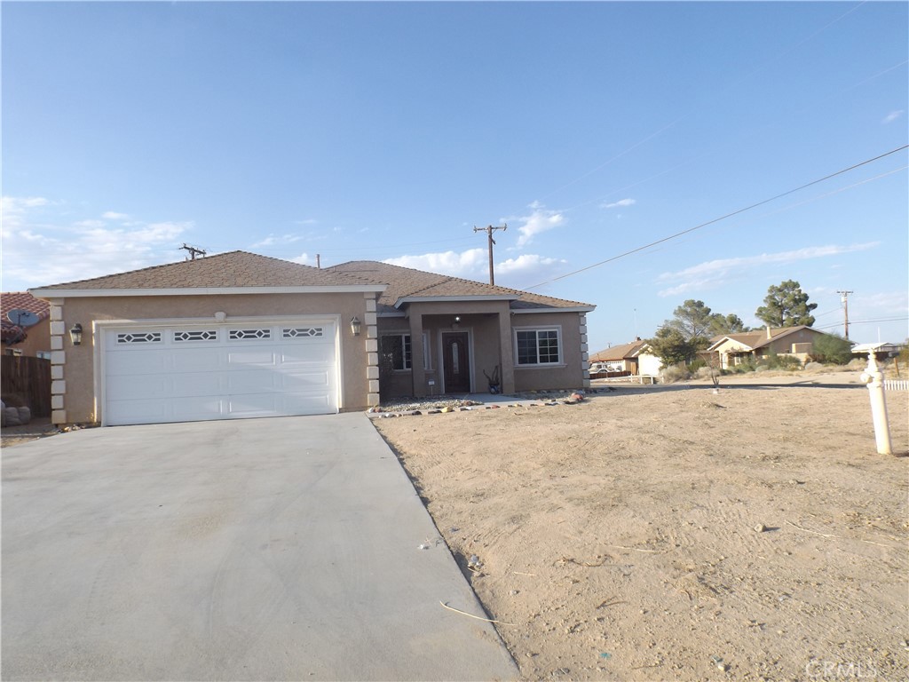 Beautiful 3-Bedroom, 2-Bathroom Corner Lot Home - A Must See! Welcome to this spacious home offering over 1,700 sq. ft. of living space, featuring a large living room, Great room with Fireplace, breakfast nook, kitchen, and a convenient laundry room. The primary suite boasts a luxurious master bathroom with dual sinks, a tiled shower, a spa tub, and tiled flooring. Situated on an R1 corner lot, this home has so much to offer.