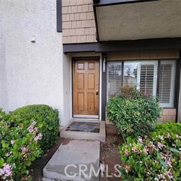 Now available for lease! This updated 2-bedroom, 1.5-bath townhouse offers comfort, style, and convenience in a well-kept community. Enjoy newer paint and flooring throughout, plus a remodeled kitchen with modern appliances. Upstairs features two spacious bedrooms, including one with its own private balcony. The private patio connects directly to a detached 2-car garage, providing easy access and added privacy. Located near shopping, dining, and major commuter routes, this home offers low-maintenance living with community amenities. A great opportunity for those seeking a clean, move-in ready rental in a prime location!