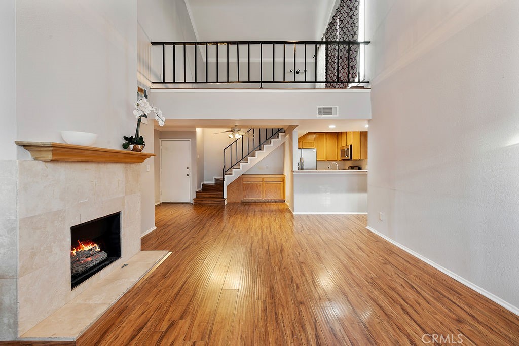 Welcome to 5325 Newcastle Ave #319 – A Stylish Top-Floor Condo in the Heart of Encino. Step into this charming, top-floor, two-story condo located in a peaceful, gated resort-style community. Ideally situated just minutes from the 101 and 405 freeways and a short walk to Ventura Boulevard’s popular shops, restaurants, and cafes, this home offers both comfort and convenience. Inside, you’ll find soaring ceilings and an abundance of natural light that create a bright, open atmosphere. The spacious living room features a cozy fireplace and opens to a private balcony overlooking beautifully landscaped courtyards. The updated kitchen is designed for both function and style, featuring granite countertops and stainless steel appliances including a gas stove, dishwasher, fridge, and microwave. Upstairs, the versatile loft provides the perfect flex space for a home office, creative studio, or relaxing retreat, complete with access to a large private deck ideal for entertaining or unwinding outdoors. The home includes two air conditioning units for year-round comfort and two assigned underground parking spaces for added security and ease. Residents of this well-maintained community enjoy access to a sparkling pool, fully equipped gym, recreation room with pool and foosball tables, and a BBQ area for outdoor gatherings. For nature lovers, the breathtaking trails of Topanga State Park are just a short drive away. With its ideal location, modern updates, and resort-style amenities, this Encino gem is the perfect place to call home.