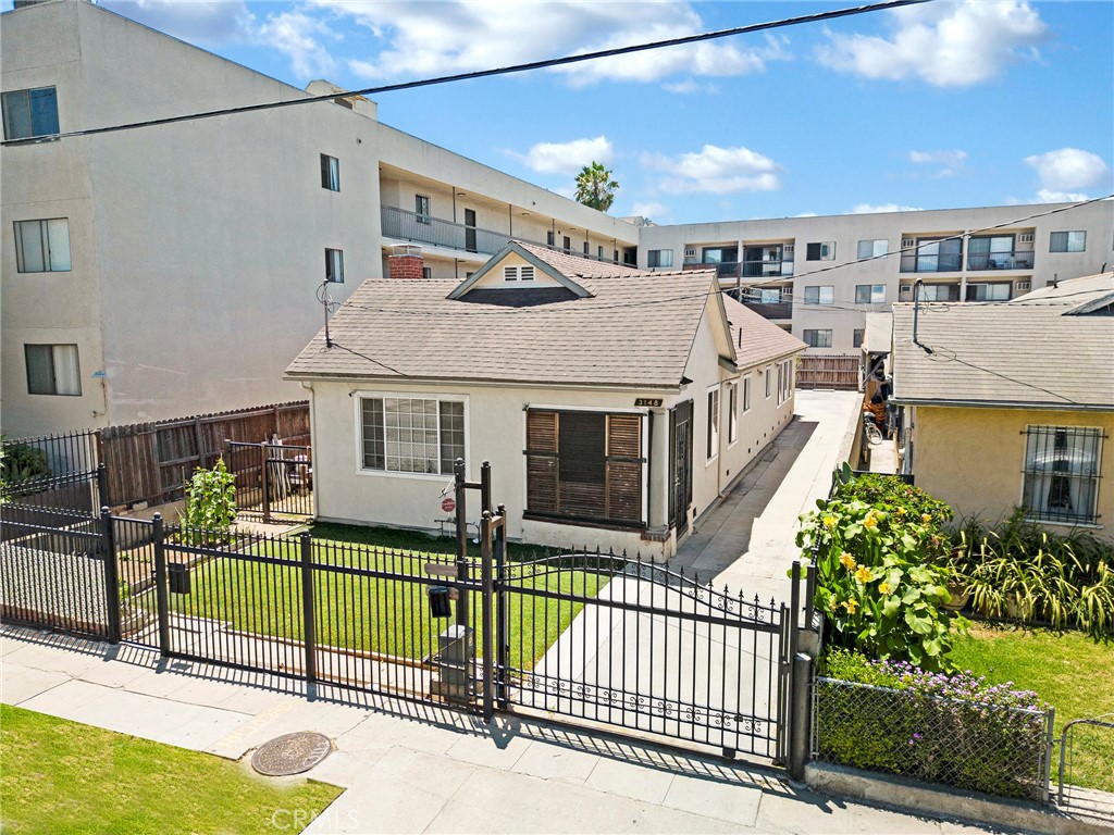Rebuilt and EXCEPTIONALLY UPGRADED property in the heart of KOREATOWN, offering a RARE combination of quality craftsmanship, development potential, and EXCELLENT LOCATION. Redone from the ground up on a 1,420 sq ft foundation with an additional 252 sq ft of new construction, this 1,672 sq ft residence with 2 units (structurally divided into two mirrored 2br/1ba units) showcases premium finishes throughout. Inside, you'll find 3/4" real cherry wood flooring, elegant crown molding - even inside the closets - and soaring 9-foot ceilings that create a bright, open ambiance. Thoughtfully modernized, the home features dual central HVAC systems, all-new copper plumbing and electrical wiring, a brand new main sewer line completed in 2022, over 38 dimmable recessed LED lights, and double-pane windows with screen shades. The gated front yard, automatic sliding iron gate, CCD security camera system, and 10-foot steel post with electrical outlet for signage offer both privacy and business-ready infrastructure. Enjoy outdoor living with beautifully crafted 2x6 redwood patio sun covers at both the front and rear entrances. ZONED R4, this property provides INCREDIBLE FLEXIBILITY - live, work, build, or invest. Whether you're looking to develop an apartment or condo project, run a professional office or preschool, or enjoy a turnkey live/work space, the opportunity is truly unmatched. All of this is just steps from Koreatown's vibrant shopping, dining, and markets - walkable, central, and full of potential. PROPERTY IS BEING SOLD AS-IS - FRONT UNIT NOT PHOTOGRAPHED