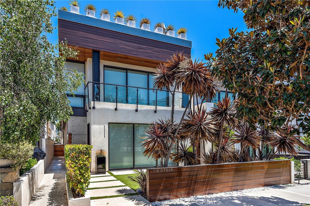 This charming Corona Del Mar back unit is nestled off the villages sought after and centrally located Acacia boulevard on the ocean side of PCH in walking distance to shopping, dining, entertainment and picturesque sandy beaches and coves. The 2 bedroom 3 bathroom residence boasts light and bright interiors with expansive ceiling heights that complement the open concept and anchored by warm light wood flooring throughout. Offering one garage and one additional covered carport you enter passed the laundry closets up the architecturally stunning glass and metal staircase to the main living space. The living areas are open to each other with spaces to accommodate dining, formal living/ lounge space and media room. The kitchen is clad in white lacquer cabinets and is a beautiful space to prepare culinary creations on and in the properties premium appliances and cooktops. The master retreat is located off the living level with dual vanity and a serene setting. Upstairs you are greeted by the secondary guest suite and access to the properties rooftop deck with breathtaking ocean and sunset views to enjoy and appreciate year round. These images are from the previous listing as a reference.