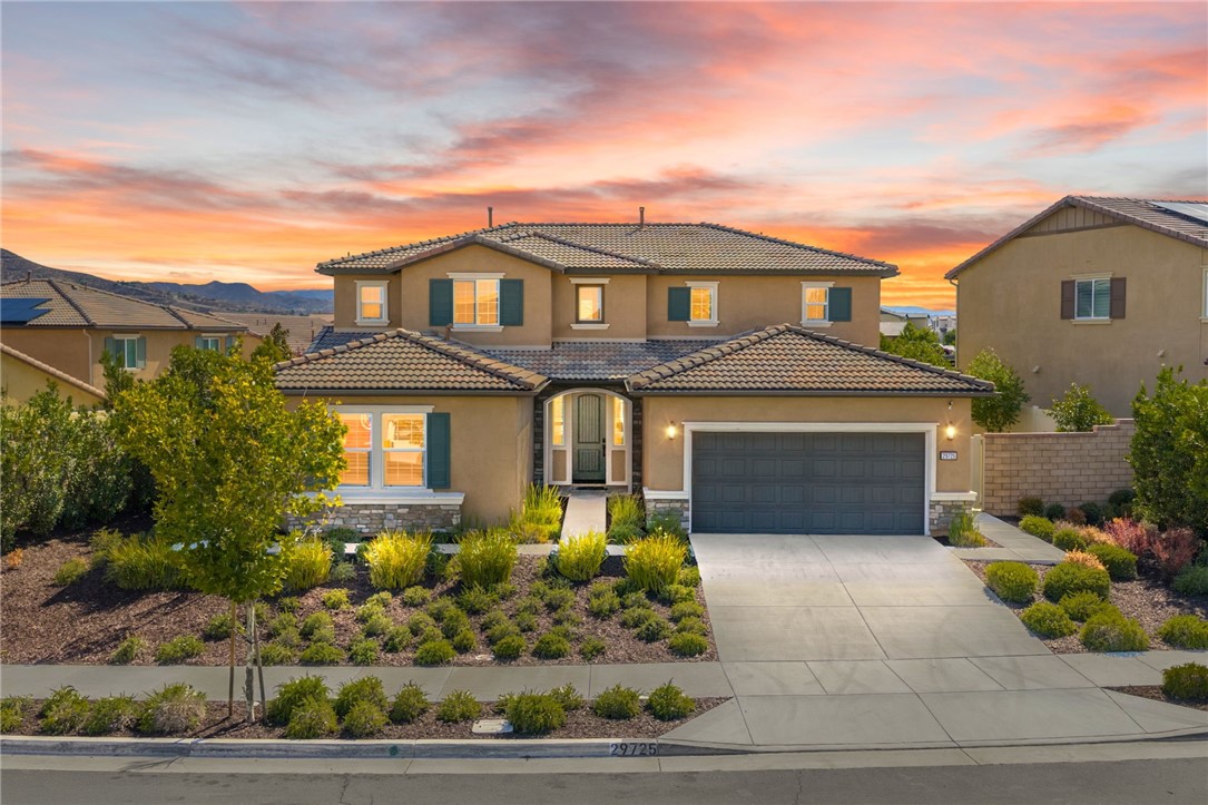NEXT GEN TURNKEY HOME WITH SOLAR, LOFT & 3-CAR TANDEM GARAGE IN AUDIE MURPHY RANCH! This spacious 5-bedroom home includes a private 1-bedroom Gen-Suite with its own entrance, living room, kitchenette, laundry, and full bath—ideal for multi-generational living or rental potential! Stunning new LVP flooring and fresh interior paint throughout. The open-concept great room flows into a dream kitchen with granite counters, stainless appliances, walk-in pantry, and oversized island with bar seating. A downstairs bedroom and full bath provide flexible space for guests or a home office. Upstairs features a spacious loft, laundry room, and primary suite with views, dual sinks, soaking tub, and separate shower. Two additional upstairs bedrooms offer comfort and functionality. Enjoy a pool-sized backyard with no rear neighbors, artificial turf, large patio, and clean, low-maintenance landscaping. Located in the resort-style Audie Murphy Ranch community with clubhouse, pools, spa, sports courts, skate park, trails, and more! Walk to Salt Creek Trail and the new Kathryn Newport Middle School. Zoned for award-winning Taawila Elementary. Close to shopping, dining, and freeway access. This is a rare opportunity in one of Menifee’s most desirable neighborhoods! Schedule your private tour today!