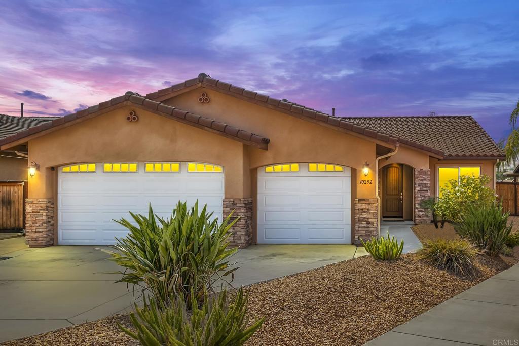 Single-Story with Mountain Views, Cul-de-Sac Location, Owned Solar & NO HOA! This beautiful 4-bedroom + bonus room, 2.5-bath home on a .21-acre lot showcases stunning mountain views and a peaceful neighborhood setting. Built in 2016, it features Alderwood cabinets, LVP flooring, and granite countertops throughout, plantation shutters, 9-ft ceilings, and ceiling fans in every room. The expansive primary retreat offers a massive walk-in closet and a relaxing place to unwind. The open concept great room is the heart of the home, highlighted by a beautiful fireplace with a classic hearth—perfect for cozy evenings or entertaining guests. Step outside to enjoy summer nights on the covered patio, practice on your private putting green, and celebrate holidays watching fireworks from your backyard. With an oversized 3-car finished garage, whole house fan, and possible RV parking, this home blends comfort, style, and function.