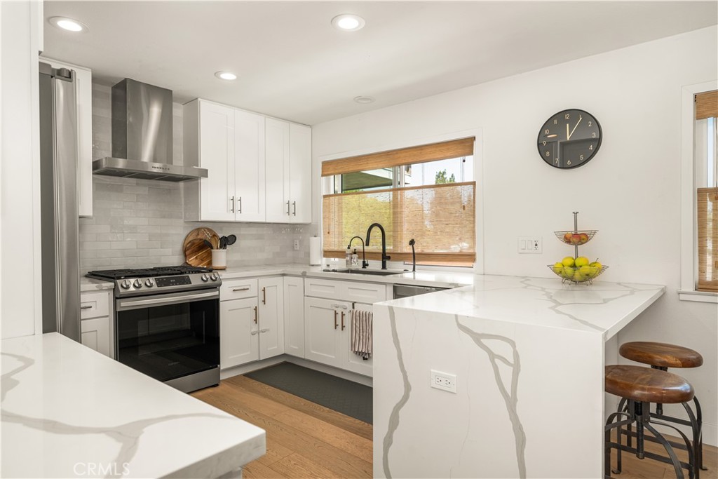 Welcome to this clean and cozy view home in Laguna Village!
This residence features beautiful European white oak wood floors throughout, complemented by light-filled windows and skylights that enhance the bright, open floor plan.
The well-appointed kitchen offers fresh white cabinets, a breakfast bar, gas range, stylish backsplash, two-way adjustable shades, assist-close cabinetry, newer water lines, and lovely views. Additional upgrades include recessed lighting, quartz countertops, updated switches, and newer windows throughout.
The living room opens to a spacious private balcony with views ranging from lush trees to sparkling city lights and distant hills. The open layout flows effortlessly from the living room to the dining area and kitchen, with a conveniently located laundry area on the same level.
Down the hall, the primary suite boasts a remodeled en-suite bathroom with dual sinks, a one-touch lighted mirror, and sliding doors leading directly to the sprawling greenbelt. Two additional bedrooms are generously sized and share a beautifully remodeled full bath with a deep soaking tub, modern fixtures, Marble countertops and a one-touch lighted mirror.
The home also offers a two-car attached garage with direct access and a thoughtfully added entry closet for extra storage. Community amenities include a pool, spa, tennis courts, and beach volleyball. Ideally located near shopping, dining, beaches, freeways, hiking trails, and more.