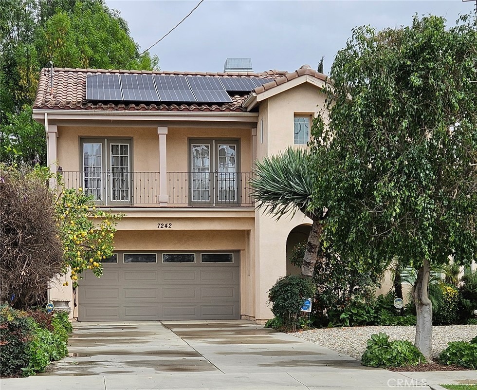 Beautifully updated 4-bedroom, 2.5-bath home with over 2,700 sq ft of living space located in a desirable Reseda neighborhood. Built in 2004, 7242 Hesperia Ave is a well-maintained property featuring a gourmet kitchen with granite countertops, stainless steel appliances, and custom cabinetry. The open floorplan includes durable tile flooring and recessed lighting throughout. The spacious primary suite offers a spa-inspired bath with soaking tub, dual vanities, and walk-in closet. Energy-efficient features include a fully owned solar system with battery backup, dual-pane windows, EV-ready garage, and a brand-new HVAC system. The private backyard is ideal for outdoor living, with mature citrus trees, drought-tolerant landscaping, a covered patio, and built-in surround sound speakers perfect for entertaining. Conveniently located near schools, parks, shopping, and major freeways. Move-in ready with modern upgrades and sustainable features.