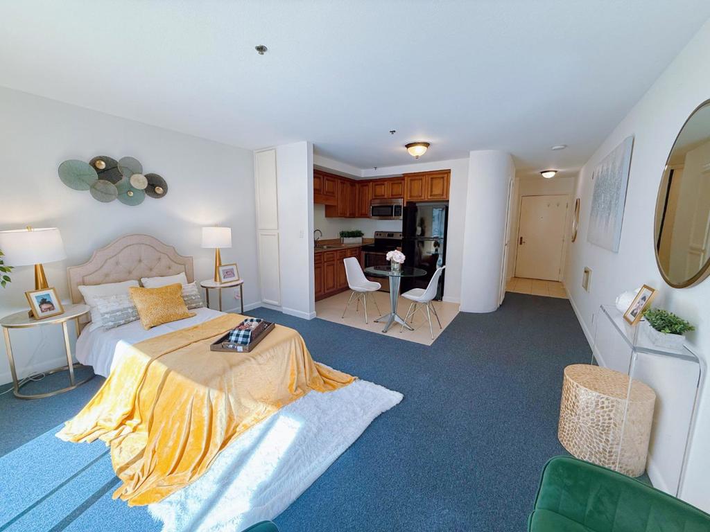 Bright  Studio in the Heart of San Mateo Welcome home to this inviting, light-filled studio just steps from everything downtown San Mateo has to offer  charming shops, great restaurants, Caltrain, medical offices, and grocery stores.  The spacious kitchen features granite countertopsperfect for cooking or entertaining. Enjoy your morning coffee on the private balcony or unwind in the open, airy living space filled with natural light.  You'll appreciate thoughtful touches like ample closet space. extra storage, and a deeded parking spot for convenience.  Located in a well-kept 55+ community, this condo offers peace of mind and easy living. While residents must be 55 or older, anyone can purchase, making it a wonderful and affordable investment opportunity.  With low monthly expenses and an unbeatable location, this gem combines comfort, value, and lifestyle  all in one perfect San Mateo home.