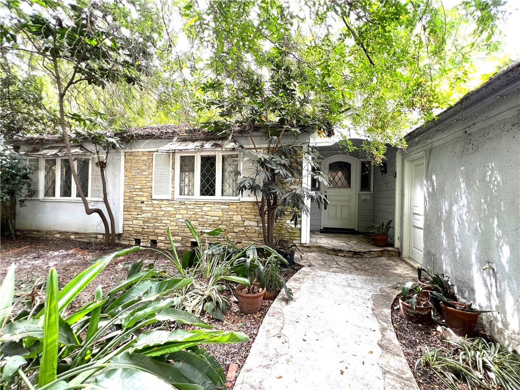 Charming 1930s Westwood Home – Prime Location with Endless Potential
Dream Home meets Investor Opportunity in this 3-bedroom, 2-bathroom 1930s Westwood classic, full of character and ready for restoration. Nestled in a desirable Westwood location near UCLA, Westwood Village, and top-tier shopping, dining, and entertainment, this home offers the perfect blend of vintage detail and prime city access.
From the moment you enter, you're welcomed into a formal living room to the left of the entry, complete with a beautiful original fireplace and large vintage windows that bathe the space with natural light perfect as a cozy sitting area, library, or home office.
Just beyond, the spacious family room boasts vaulted wood ceilings, a second fireplace, and large picture windows that create a warm, inviting atmosphere for everyday living or entertaining. Throughout the home, you'll find original lead diamond casement windows, built-in cabinetry, and vintage details that tell a story and invite restoration.
The primary suite offers custom bookshelves and cabinets, its own fireplace, a walk-in closet and a picturesque window that captures serene morning light.
The kitchen features a custom built-in refrigerator, a central island, and laundry hookups near a convenient side door leading to the backyard. Step outside to discover a multi-level outdoor space, including a generous second-tier area offering ample open space for recreation, entertaining, or future landscape design possibilities.
Don’t miss this opportunity to unlock the full potential of this timeless Westwood treasure in one of LA’s most sought-after neighborhoods.