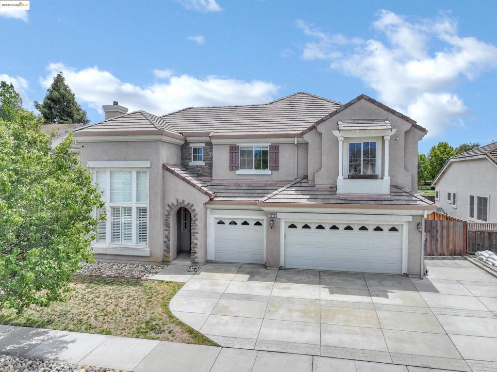 1212 Landover Ct in Brentwood is one of those homes that just feels right from the moment you step inside. Tucked into a quiet, well-kept court, this spacious two-story Pulte home strikes the perfect balance of comfort, function, and charm. With 4 generously sized bedrooms, 3.5 baths, and over 3,100 sqft of living space, there’s room for everyone — and then some. The layout flows effortlessly, featuring a formal dining area that’s perfect for hosting family dinners or holiday celebrations. With a convenient gas fireplace and an additional cozy wood burning fireplace — make it feel warm and inviting all year round. The kitchen opens to the living space, making it easy to stay connected while cooking or entertaining. Step out back to a thoughtfully landscaped yard that’s both low-maintenance and relaxing, complete with an irrigated garden space ready for your herbs, veggies, or seasonal blooms. There’s even room to add your personal touches. Whether you're looking for a place to grow into or just something that feels like “home,” this one checks all the boxes. You’ll know it when you see it.