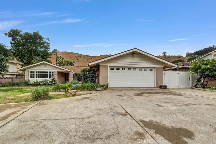 Welcome to this beautifully maintained single-story 4-bedroom, 3-bathroom home located in the highly desirable Olinda Village neighborhood. Situated on an extra-large lot, this home offers the perfect blend of comfort, space, and privacy, making it an ideal retreat while still being conveniently close to everything you need. Step inside and you’ll immediately appreciate the open floor plan that creates a bright and spacious atmosphere, perfect for both everyday living and entertaining guests. The generous living areas flow seamlessly, offering plenty of room for family gatherings, quiet evenings, or hosting friends. The home’s private and peaceful backyard is a true highlight, surrounded by mature landscaping that provides a tranquil setting with ample space to relax, garden, or expand. With room to grow, this property also offers RV parking and plenty of space for additional vehicles, toys, or future possibilities. While the home feels secluded and private, its location provides easy access to freeways, top-rated Brea Olinda School District, shopping, and dining, making daily commutes and errands simple and convenient. Schedule your private tour today!