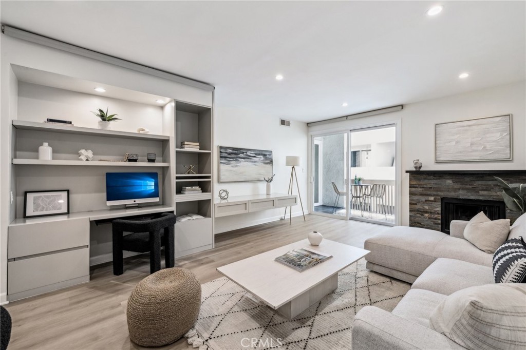 Proudly introducing this beautifully updated 2-bedroom, 2-bathroom condo offering 1,289 sq ft of thoughtfully designed living space. As you enter, experience brand new luxury vinyl plank flooring and refreshed finishes throughout. The spacious kitchen boasts stainless steel appliances, Caesarstone countertops, and a cozy breakfast nook—perfect for casual dining. The open-concept living and dining area is enhanced by custom built-ins ideal for a concealable home office or entertainment setup, and a sleek modern fireplace. Enjoy seamless indoor-outdoor living with access to a private balcony from both the living room and the serene primary suite. Gas grills are permitted on the patio, making al fresco cooking and dining a breeze. The primary bedroom features dual closets with organizers and a spa-like en-suite bath complete with dual sinks, quartz countertops, a floating vanity with hidden outlets, and a jetted tub/shower combo. The secondary bathroom includes a glass-enclosed shower, floating vanity, and chic modern tile. Additional highlights include in-unit laundry, new high-efficiency 14 SEER HVAC with transferable 2-year warranty, two parking spaces, and access to a heated community spa. Live just moments from Ocean Avenue, Santa Monica Beach and Pier, 3rd Street Promenade, the iconic Santa Monica stairs, highly ranked elementary, middle and high schools, and the boutiques and restaurants North of Montana. This is the ideal blend of comfort, style, and convenience in one of Santa Monica’s most sought-after neighborhoods.