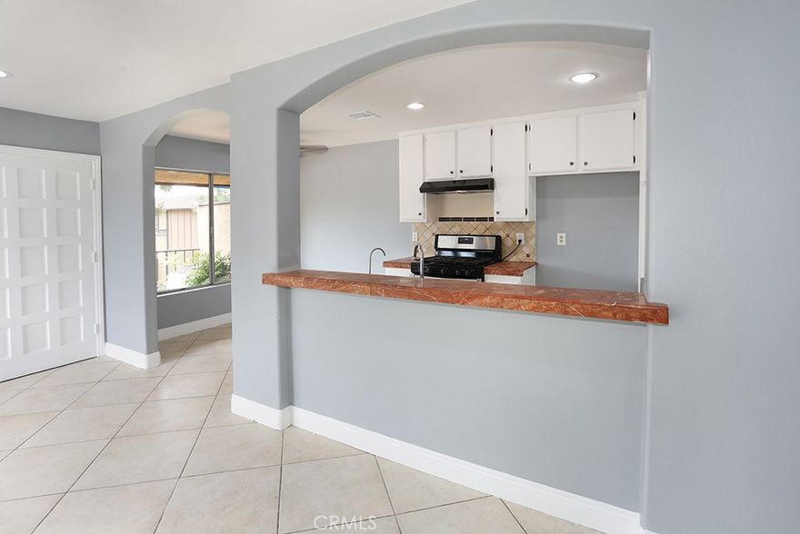 HOA is actually $260.00 a month. It covers Fire insurance, Water, and Trash. Corner location! No one above, no one below! Spacious Condo Near Disneyland—move–in Ready! This small open community has one of the lowest HOAs in Orange County. Don't miss this rare opportunity to own a beautifully updated, move-in-ready condominium just minutes from Disneyland and all the excitement of Anaheim! This spacious unit features a generous main bedroom with a large walk-in closet, modern updated flooring, fresh paint, and a beautifully renovated bathroom. The kitchen has a cozy eating area, a range oven, and a brand new dishwasher. You'll love the convenience of the in-unit laundry area, complete with a *newer washer and dryer*. Step outside to a charming front terrace — the perfect spot for a small patio set and some potted plants to create your relaxing outdoor space. This unit also includes ceiling fans in every room for year-round comfort. Centrally located near top attractions, restaurants, and major shopping centers, this condo offers unbeatable value and convenience. Are you a first-time home buyer or investor looking for a convenient, well-priced property? Look no more.