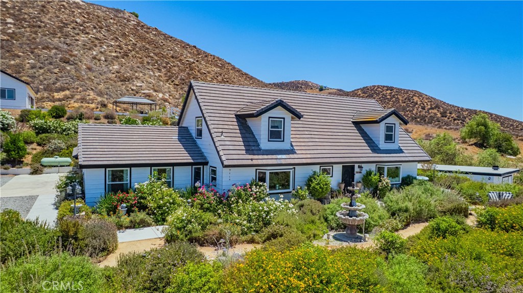 Country Living in the City…..Welcome to your dream retreat! Nestled on a sprawling 2.31 acre lot, this beautifully remodeled estate offers the best of peaceful country living with the convenience of city amenities. Enjoy breathtaking views, wide open space, and unmatched versatility in this rare Wildomar gem. The main house boasts 2,700 sq ft of fully remodeled living space featuring 3 spacious bedrooms and 3 modern bathrooms, along with a 3-car garage. Every detail has been thoughtfully upgraded to blend comfort with style.
Need extra space…..The detached studio apartment offers endless possibilities, perfect for guests, rental income, or a private office and comes with its own 3-car garage. Step outside and enjoy resort-style amenities, Sparkling pool and spa, Fully equipped outdoor kitchen
And Cozy fire pit for evenings under the stars For the hobbyist or business owner, the detached shop offers plenty of room for tools, toys, or projects. Animal lovers will appreciate the fully fenced livestock area and dedicated dog run, making this property ideal for horses, goats, or your furry friends.
Don’t miss this opportunity to own a private sanctuary with unbeatable views, room to roam, and space to live your lifestyle your way — all just minutes from shopping, dining, and freeway access.