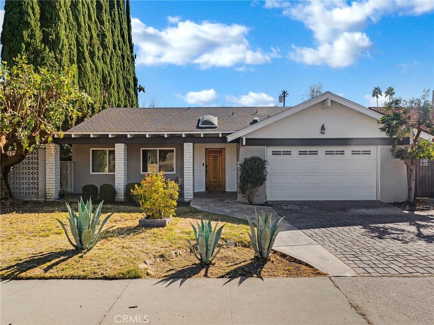 Welcome to this beautifully updated 4-bedroom, 2 1/2 bathroom home located in one of West Hills' most desirable neighborhoods! As you enter, you're greeted by a spacious open-concept layout that combines the living room, dining area, and kitchen—perfect for entertaining. The home features stylish vinyl wood flooring throughout, offering a clean and modern look. The remodeled kitchen includes a convenient breakfast bar and comes fully equipped with stainless steel appliances, including a refrigerator, dishwasher, range/oven, and microwave—ideal for any home chef. The large primary suite offers a remodeled en-suite bathroom and plenty of closet space, while the three additional bedrooms share a second updated full bath. This home also includes an attached 2-car garage, washer and dryer hookups for your convenience, and central air conditioning and heating to keep you comfortable year-round. The private, spacious backyard is perfect for outdoor entertaining or simply relaxing. Centrally located near great restaurants, entertainment, and shopping, this West Hills gem is one you won’t want to miss!