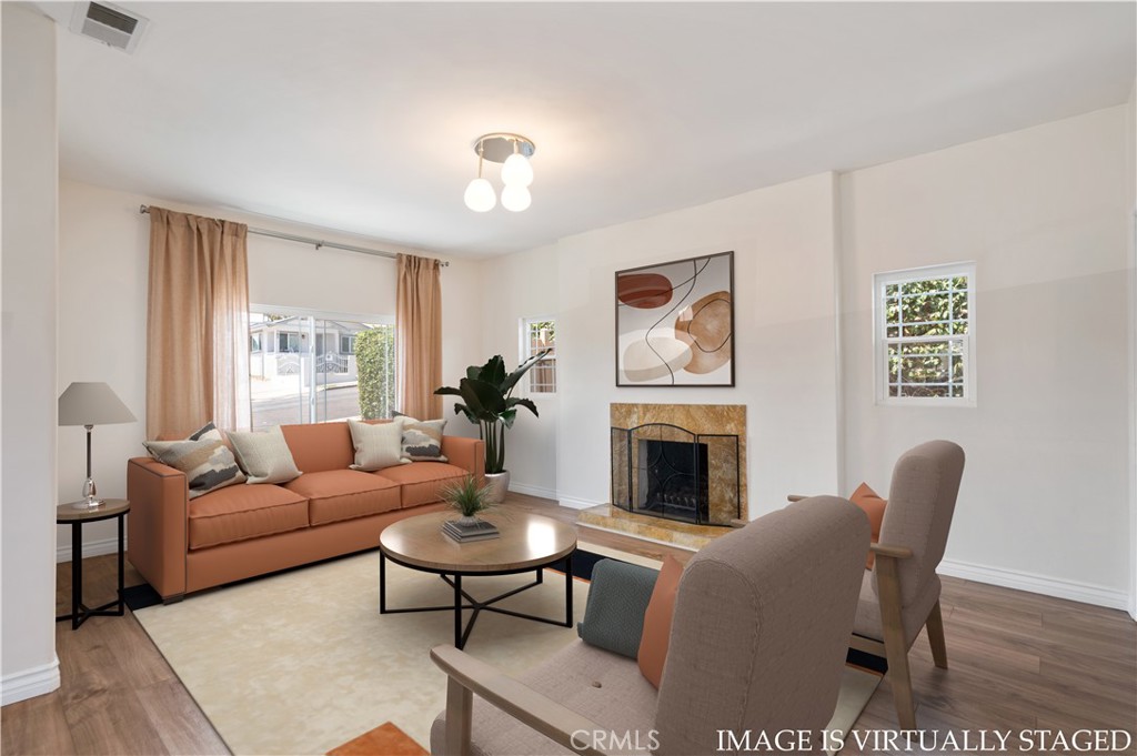 Step into a thoughtfully refreshed home that blends historic character with modern comfort on a LARD1.5 lot! Located in the Holy Trinity neighborhood of San Pedro, this 3 bedroom, 2 bathroom residence welcomes you with newer laminate flooring, dual-pane windows, and sliding glass doors. Natural light fills the interior, creating a bright and airy feel throughout. At the heart of the home is a remodeled kitchen designed for both everyday living and entertaining. It features ample cabinetry, in-unit laundry for convenience, and two dishwashers, a rare luxury that makes cleanup effortless after meals or dinner parties. Just off the kitchen, the dining and living areas connect seamlessly and open to a welcoming porch, setting the stage for gatherings large or small. The spacious primary suite is a true retreat, complete with a full ensuite bath and a generously sized walk-in closet. The secondary bedrooms are light-filled and comfortable; one even offers direct access to the backyard, creating an easy indoor/outdoor flow perfect for Southern California living. Outdoors, the large driveway provides ample parking, while the expansive yard feels like a private sanctuary. Mature fruit trees in the front yard, loquats and mulberries thrive, while the backyard offers pomegranates, apricots, peaches, and passion fruit. A dedicated gardening bed is ready for those with a green thumb. This lush setting provides shade, seasonal harvests, and a beautiful backdrop for entertaining. Adding to its tranquility, the property backs directly to Bandini Canyon Park and Trail, offering a peaceful backdrop of nature and enhanced privacy. Adding even more versatility, a detached brick-and-mortar bonus den with its own concrete pad provides flexible space for a home office, creative studio, or gym. Beyond its immediate comfort, the home carries exciting potential with LARD1.5 zoning, which may allow for additional units or ADU development (buyer to verify). Minutes from the future San Pedro Waterfront, local shops, freeways, and restaurants. With a flexible floor plan, modern upgrades, a lush park-backing lot, exciting future for San Pedro, and plenty of room to grow, 776 W. Sepulveda Street is the perfect blend of charm, functionality, and opportunity!