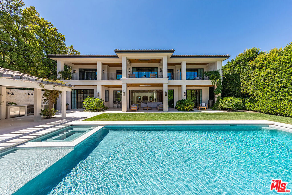 One of a kind architectural masterpiece in the Pacific Palisades just minutes from The Village. Jet Liner views from the Los Padres Mountains to the coastline of Santa Monica Bay and "Queens Necklace" of distant Palos Verdes. With no expense spared, this property boasts luxury quality construction, with grand scale and volume throughout, flooded with fresh air and brilliant Southern California sunlight. Hidden and secure within a boutique gated community, the nearly 1-acre estate sits behind its own gates enveloped in privacy, serenity, elegance, and romance. Each room, including all six beautiful bedroom suites, exudes immaculate attention to detail, presenting a breathtaking moment of its own with the finest bespoke finishes. The steel doors and windows provide a sleek and modern aesthetic while natural light fills the true California indoor/outdoor living spaces with warmth and fresh sea air. Endless opportunities to entertain include seated dinners in the exquisite formal dining room, multiple private patios, or the open resort-like pool cabana. The saltwater pool complete with a Baja shelf, hot tub, and swim jets offers a refreshing oasis. For the ultimate relaxation and wellness experience, the estate features a fully equipped gym along with a world class spa with teak wood details, including a hot and cold plunge, steam room, and sauna. State-of-the-art security system and Control 4 Lutron lighting ensure safety and convenience. Complete with full size movie theatre. Nestled in the peaceful embrace of the quiet mountains, but only minutes from the beach and heart of the Palisades, this unrivaled offering exemplifies the epitome of luxury living.