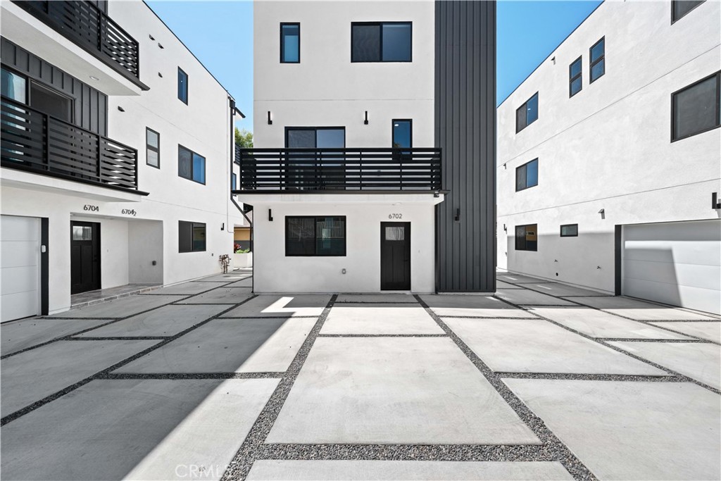 MOVE IN READY TODAY: 100% BRAND NEW CONSTRUCTION UNIT featuring large 4 bedrooms and 4.5 bathrooms. Located in downtown Van Nuys, everything you need is within driving distance. The floor plan offers modern living at its finest with a functional 1,762 SQ FT of usable space. This unit has two balconies and in-unit laundry facilities. Ascend to the expansive, luminous open concept living area & combined kitchen & dining area. Enjoy privacy and tranquility in your new home. Retreat to the primary bedrooms featuring a luxurious en-suite bath and ample closet space. All bedrooms offer generous dimensions and large closets. Embrace the essence of community living & make this your home today! 6702 Kester Ave is part of a 5 Unit resident community located in Van Nuys neighborhood 91405-zip code. Stove, refrigerator, dishwasher, microwave hood vent & washer/dryer included. Central AC/HVAC. Conveniently located in a prime location, near schools, shopping, golf courses, recreational areas, dining, and easy access to major freeways, this property offers an outstanding easy live, work and play lifestyle. This unit is perfect for a multi-generational extended family or the working adults that prefer to enter into a co-living set up. Call today and book your private tour.