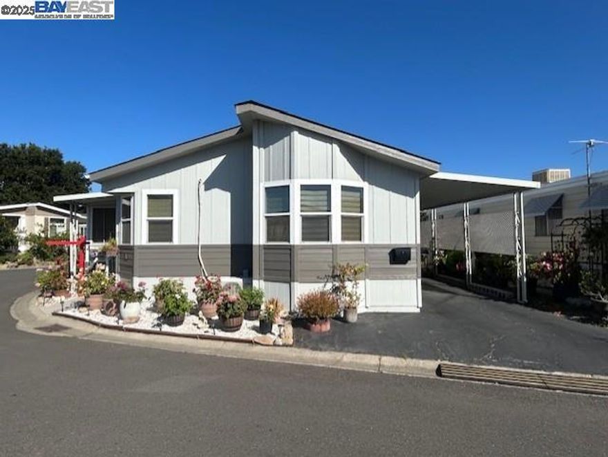 Lovely manufactured home in Hayward Mobile (adult 55+ park) features: 2 bedrooms; den; 2 full baths; living room with fire place and two cell clear story; spacious kitchen with island and nook area; indoor laundry room with washer and dryer; primary bedroom with walk in closet and private glamour bath with soaking tub and separate stall shower; large enclosed porch; corner lot, large custom shed, low space rent only $529 per month & much more. Fireplaces: GAS,GSR,LIV,