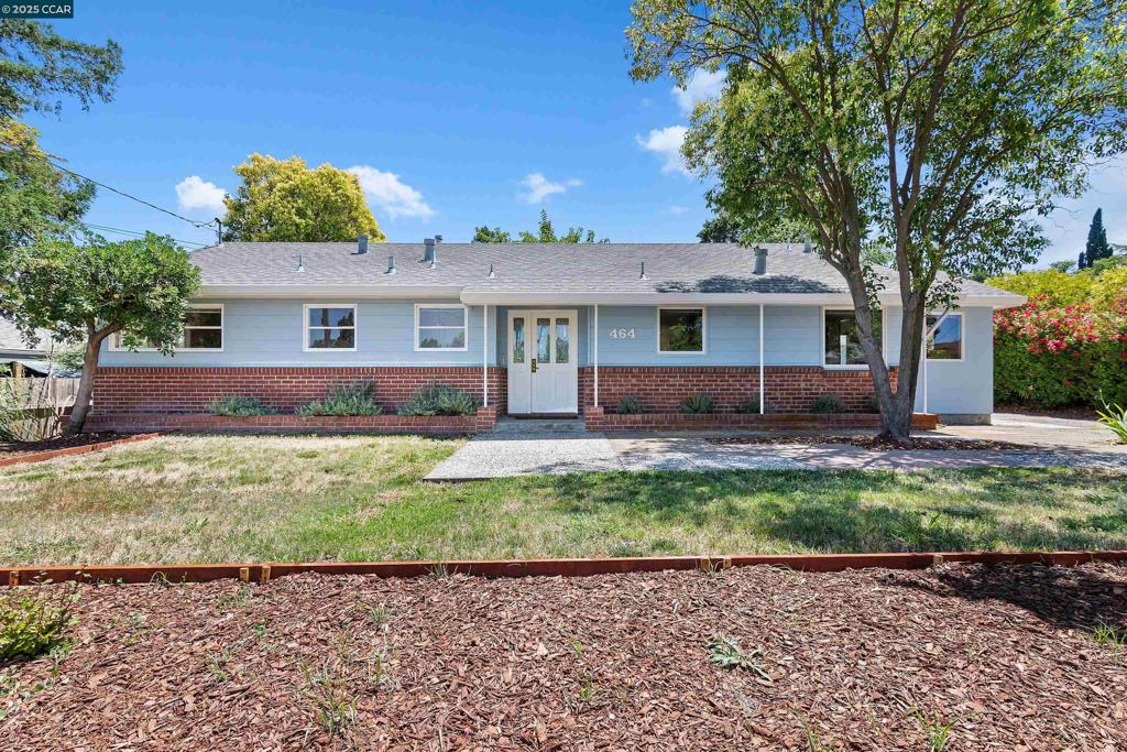 Welcome to this charming single story home located on a huge, spacious lot with endless possibilities. This well-maintained home features three spacious bedrooms, a full bathroom conveniently located in the hallway, and a half bath just off the entry. Inside, you’ll also find original oak hardwood flooring, a cozy wood-burning fireplace, and tons of natural light throughout. The kitchen was remodeled in 1998 and includes custom cherry wood cabinetry, two sinks, stainless steel appliances, and a built-in wine fridge. Perfect for everyday living or entertaining. Enjoy seamless indoor-outdoor living with backyard access from the laundry room, dining room, and front bedroom. Recent upgrades include a tankless gas water heater (2016) and a brand-new LG air conditioning system. Off the kitchen is a spacious indoor laundry room. Step outside and take in the expansive backyard. Featuring a wooden patio, 2 car garage, storage area, and shed—offering plenty of room for options to entertain. The large detached garage/workshop is equipped with pass-through garage doors, a gas heater, and an air compressor located in a connected remote shed. Close proximity to downtown Pleasant Hill, top-rated schools, shops, and more. The home is full of charm, functionality, and potential. Don't miss out!