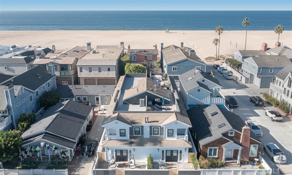 GORGEOUS FURNISHED VACATION HOME - just one house from the sand. This beautifully remodeled home features 4 bedrooms, 4 baths, a spacious loft, and a large rooftop deck with views. Blending beach house style with contemporary finishes, the turn-key residence impresses inside and out. An open-concept first floor enjoys multiple entertaining spaces, a chef's kitchen with stainless steel appliances, a breakfast bar, and a main-level bedroom and bath. Upstairs is the primary suite, plus two additional bedrooms, a large open loft, and a laundry room. The rooftop deck is perfect for al fresco entertaining and enjoys views of the beach, Fashion Island, and the Newport Hills. An additional occupancy tax of 10% will be added to bookings of less than 30 days. STLP 13976. Weekly rates available upon request. This is an off-season rate for September-May.