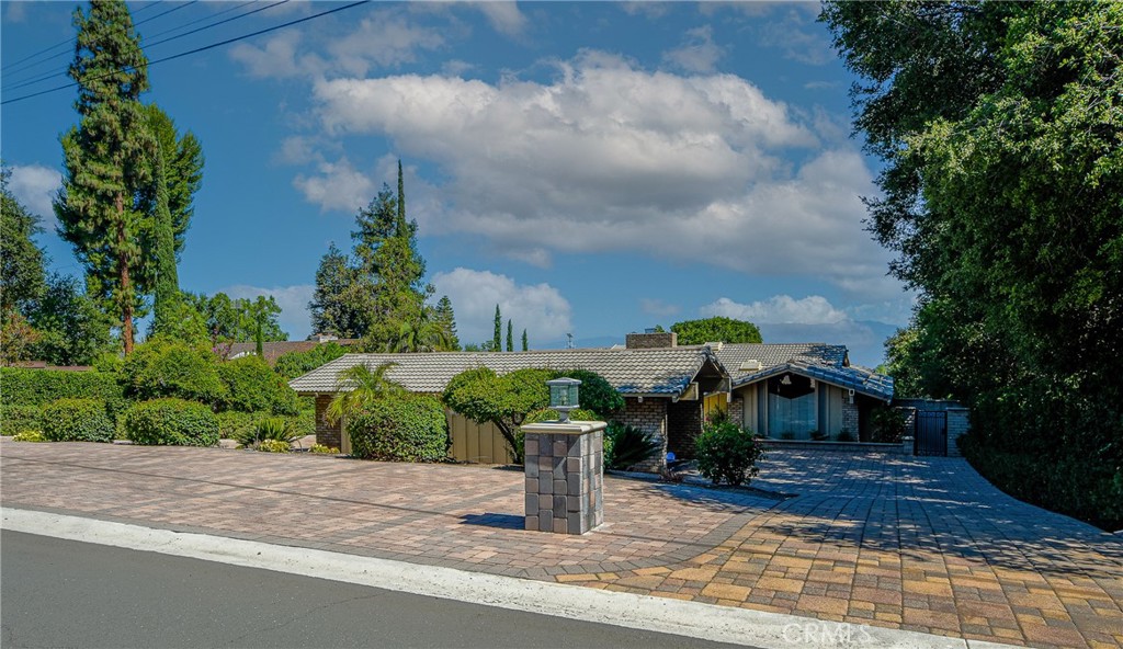 A complete masterpiece designed by architect David George has finally hit the market! Welcome to this luxurious home located at 4308 Crown Ranch Road in Corona, California. An exceptional custom-built single story estate in one of south Corona's most desirable neighborhoods! This beautifully maintained home offers approximately 2872 sq. ft. of spacious living on a sprawling .34 acre (14,810 lot), blending timeless charm with modern comforts. Step inside to discover an inviting open floor plan filled with natural light, featuring three spacious bedrooms and three well appointed bathrooms. The expansive gourmet kitchen is a chef's dream, boasting custom cabinetry, generous counter space and a adjacent dining area ideal for family gatherings. The warm and welcoming living spaces include a grand fireplace and large windows that frame peaceful garden views. Enjoy beautifully landscaped grounds with mature trees. Lots of room for entertaining. Located close to award winning schools and popular shopping centers like the Crossings and Dos Lagos. This home offers the perfect blend of privacy and convenience.