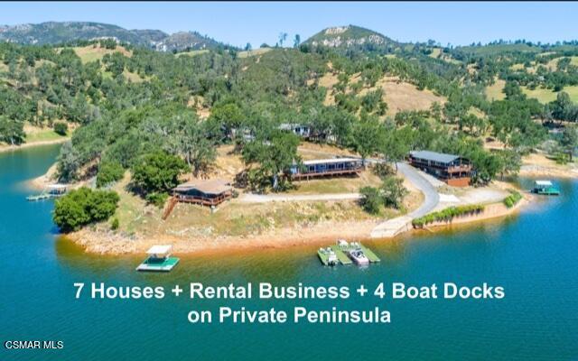 LAKEFRONT PENINSULA! 1 Property with 7 Houses, 5 Boat Docks on Lake Nacimiento in the beautiful Paso Robles Wine Country - If you dream of owning lake front property where you can vacation or spend time with all of your friends at one property, this is the place! Property sleeps 50+ people and comes furnished. If you want the huge benefit of income as well, the current owners will pass along the highly successful Turnkey Rental Business (Lakefront at Lands End) - Automated Proprietary Website @ Naci7.Com generates 90%+ of the rentals. Property has an experienced onsite manager. This private gated property is arguably the best location on the lake!SPECTACULAR one-of-a kind LAKE FRONT property! This 5 acre property, nestled behind a private gate, feels secluded and peaceful, yet is located on an ideal central location of Lake Nacimiento. In total, the homes have 18 bedrooms and 11.5 bathrooms. All homes have been updated, have spacious decks and beautiful lake views. Enjoy the convenience of having a private launch ramp on your property along with 5 covered boat parking spaces, and additional storage facilities. This property is truly a hidden gem and the details are far too numerous to list. The current owners have built a successful vacation rental business, which allows them to enjoy the property for personal use, as well as earn income. This property allows for immediate use, immediate operating income, and is currently operated with onsite caretakers. Owners have the flexibility to use one home or all, if they want to get away with a large group. Property can be enjoyed year round with activities such as boating, fishing, water sports, swimming, hiking, wine tasting, or simply relaxing on the deck and enjoying the incredible views. Located in the Central Coast, the Paso Robles wine country is known for its over 200 wineries. The location of this property on the lake is unique in that even when the lake has been as low as 20%, the water level in front of the property is still up to 60 feet deep. Details of the vacation business can be viewed at Naci7.com