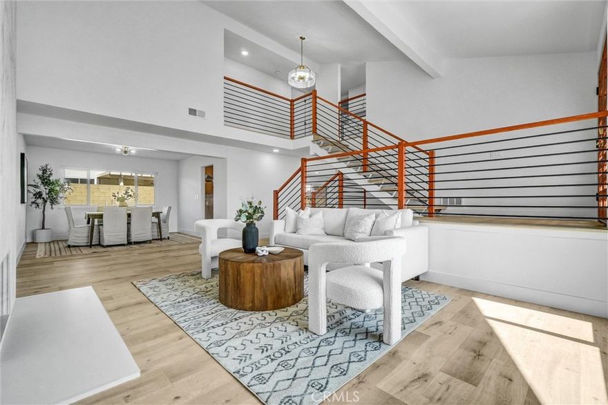 Stunning and rarely available luxury home in one of Cerritos’ most sought-after neighborhoods, located within the top-rated ABC Unified School District. This fully renovated two-story residence features new laminate flooring throughout, recessed lighting, and stylish modern fixtures. The open-concept layout highlights a brand-new kitchen with quartz waterfall countertops and stainless-steel appliances, seamlessly connecting the living and family rooms. The spacious master suite offers cathedral ceilings, a private balcony, and a beautifully upgraded bathroom with a bathtub inside the shower. Additional features include a bedroom and full bath downstairs, a guest half bath, central AC, and a backyard with a sparkling pool—perfect for entertaining. Conveniently situated near major freeways, parks, and shopping centers, this home is a rare opportunity to own a move-in-ready property in one of Cerritos’ most desirable communities.