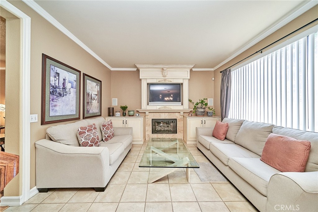 Welcome to this beautifully upgraded home in the prestigious Independence at Terra Vista gated community. Blending style and comfort, this residence offers exceptional curb appeal and a wealth of custom features throughout.
Inside, you’ll find custom-made window coverings, a bespoke fireplace console, and built-in cabinetry with a stereo/TV system—perfect for entertaining. The kitchen and all bathrooms feature elegant granite countertops, while a cozy breakfast nook and laminate flooring throughout the upstairs add warmth and functionality.
The spacious master bedroom includes a serene retreat area, complemented by two additional generously sized bedrooms. A convenient laundry closet is located in the upstairs hallway for added ease.
Step outside to a private backyard oasis featuring a large raised deck, built-in barbecue, and an aluminum patio cover with a ceiling fan—ideal for year-round outdoor living, relaxation, and entertaining.
Additional highlights include a two-car garage with built-in storage cabinets. This home is ideally located near top-rated schools, beautiful parks, shopping centers, and the renowned Victoria Gardens Mall.
Don’t miss the opportunity to make this stunning property your new home!