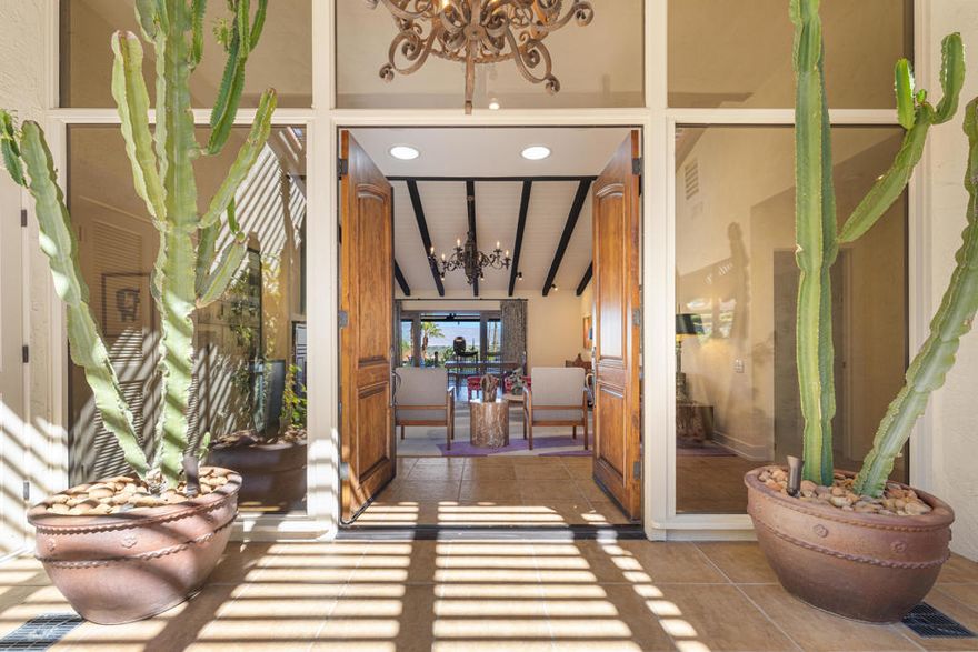 Experience refined desert living in this stunning hillside residence on FEE SIMPLE land, set within the prestigious Thunderbird Villas. This 3 bedroom, 3 bath home embodies luxury, comfort, and thoughtful design at every turn.Step inside to an open, airy layout featuring vaulted ceilings with wood beams, a gas fireplace, and French doors framing sweeping valley and mountain views. Each spacious en-suite bedroom offers comfort, privacy, and timeless style.The remodeled kitchen is a true showpiece, light, bright, and highly functional with quartz countertops, state of the art stainless steel appliances, and an inviting atmosphere perfect for cooking and entertaining.Every detail reflects exceptional care and craftsmanship, from the solid wood doors and smart home updates to the finished garage with mini-split for year round comfort. Outdoors, enjoy multiple spaces to relax and entertain, including a gated courtyard with built-in BBQ, a pergola-covered patio, and breathtaking mountain vistas from nearly every angle.A rare and valuable highlight, this home sits on FEE SIMPLE land (the land lease has been bought out!), offering true ownership and lasting value.Thunderbird Villas community offers guard gated entry, lush landscaping, community pools, cable, and trash service, along with golf cart access to the adjacent Thunderbird Country Club.With panoramic valley views from the back and dramatic mountain views from the front, this home delivers the best of both worlds, an elevated, luxurious desert lifestyle that's truly turnkey. Opportunities like this are rare and this home is a must see! Arrange your private viewing today.