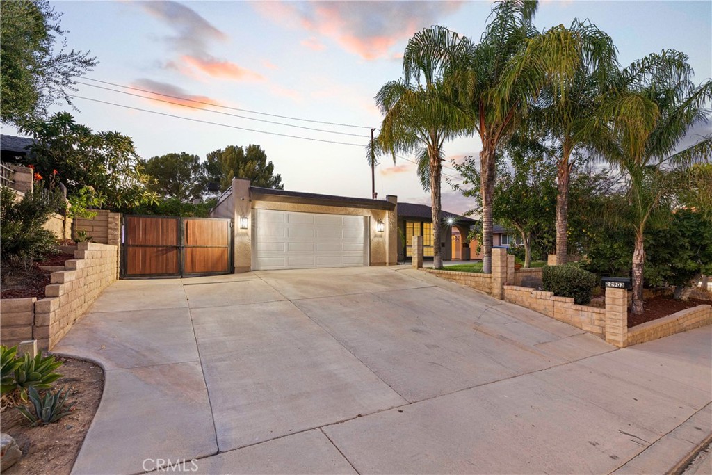 Welcome to 22903 Vista Delgado Dr, a stunning, updated residence nestled in the sought-after Valencia community; conveniently located nearby parks, shopping, and dining.
Upon entering, you'll be greeted by a spacious open floor plan that seamlessly connects the living spaces, creating an inviting atmosphere for both relaxation and entertaining. The kitchen has been thoughtfully redesigned and updated, boasting modern stainless steel appliances, elegant granite countertops, a custom tile backsplash and stylish cabinetry, making it a dream for any home chef. The expansive family room is a true centerpiece, featuring a cozy fireplace with an elegant hearth that adds warmth and charm. Both bathrooms have been updated with exquisite stonework and modern fixtures, enhancing the home's luxurious feel. Throughout the home, you'll find stylish luxury vinyl plank (LVP) flooring, complemented by beautiful tile flooring in the kitchen and bathrooms. This combination ensures both durability and aesthetic appeal.
Step outside to the private, hardscaped backyard, which offers plenty of space for entertaining and recreation. It features multiple fruit trees, elevated planting areas and overhead string lighting, creating a perfect setting for outdoor gatherings. With no neighbors behind, you'll enjoy added privacy and tranquility. The west side yard features a beautifully adorned patio with brick and stonework, providing an al fresco dining area that is sure to impress your guests. The west side also features a double gated entry for potential RV Parking.
With no HOA or Mello Roos this home is a must see.