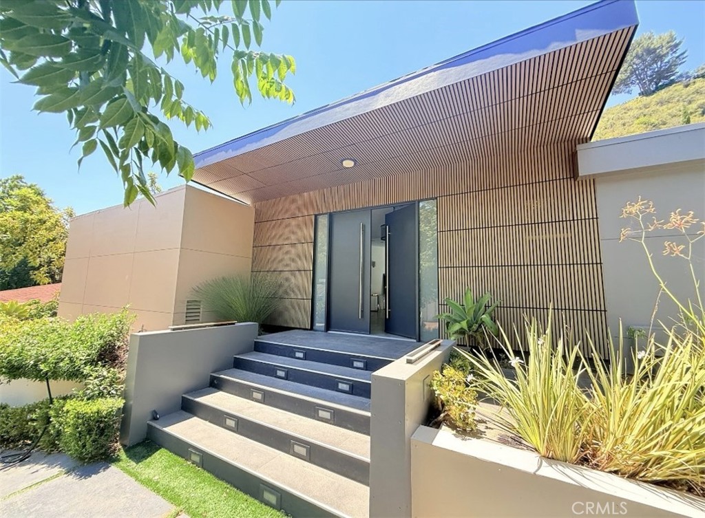 Luxury Modern in the heart of most distinguished area in Bel Air. The property suits the most discerning individuals who enjoy luxurious amenities with a chique, serene and quiet lifestyle of perfect mix of nature nestled only minutes away from all Urban Luxuries and Access to what Los Angeles has to offer.
4 Bedrooms and 5 Bathrooms. Large private POOL and SPA and Home Theater room. This contemporary mid-century modern estate sits atop a private gated circular driveway nestled in Bel Air, 1.5 miles north of Sunset Blvd. Easy access in lower Bel Air off of Bellagio Rd.
Bright, private, open floor plan and freshly torn out of Architectural Digest, your friends and family will be awed by your discerning taste of living style when they visit
The house is an entertainers paradise with an open floor plan. Control4 Automated, LED Mood lighting. Designer European custom kitchen with MIELE Appliances provide a chef's heaven, a workspace designed to live, cook, and entertain in a pinnacle of modern living. Formal dining room attached to the kitchen where indoors and outdoors become one. Office/guest-room with it's own separate entry that can be used for work-at-home professional or live-in maid.
Bedrooms are separated to the side with unique and tasteful elegant collection of architectural tiles and hardware all designed with the spirit of individual hospitality. Master bedroom suite is romantic, elegant, and relaxing with lighting to make your evenings and mornings relaxing and pleasant alike.
There is more than meets the eye. Must experience for yourself day or night. Just finished recent upgrades and the house is ready for the most particular person or family who loves to entertain. Minutes away from UCLA, Santa Monica Beach, Sunset Strip, and Hollywood. Central location in the most elite neighborhood of Los Angeles. No Smoking in the house.
Freshly Updated - Long Term or Short Term Fully Furnished Available. Listed rate is for one year unfurnished lease - Short Term Rates depends on the length of rental.