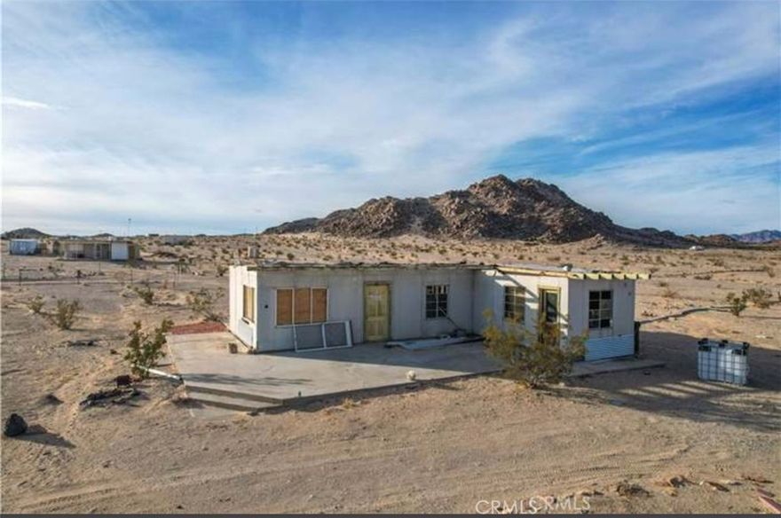 This desert cabin is full of possibilities. The location is ideal with 360 amazing views. Away from the noise and chaos of the city. It sits at the end of the street, surrounded by government land to the back, across from the gorgeous Bouillon Mountains and endless miles of preserved desert.
The cabin is in need of work, currently not in livable condition.  The bones are good, there's new framing and insulation, good roof.  
Bigger than most of the original cabins, it's 768 square feet with solid concrete slab throughout and extending for a large back patio area.
Water must be either hauled or drill a well. Nearby properties have found hot springs.
There is a permit on record for electricity, potentially allowing the possibility to connect without converting to an SFR.
5 acres of desert beauty. Bring your tools and imagination.  Enjoy a peace that few can imagine.
The possibilities are endless. Buy now while it's still a hidden gem. Cash only.