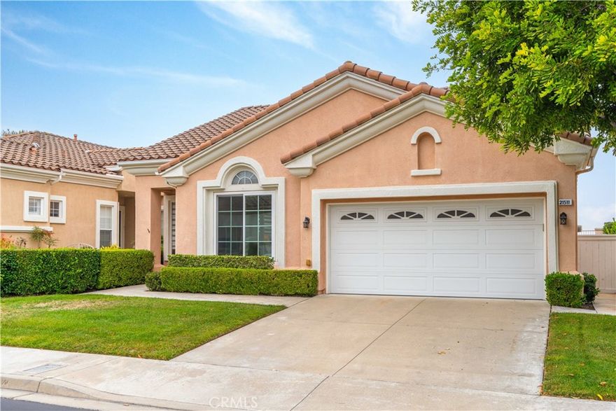 Welcome home to coveted guard-gated Palmia. This desirable floor plan in the Vistas is a gorgeous, COMPLETELY REMODELED single level with 2 primary bedrooms boasting private en-suite baths + guest bath. Home features neutral paint, open, flowing floorplan & lots of windows & view from back yard! Kitchen is STUNNING with upgraded slow-close cabinets & drawers, stainless steel appliances & plenty of counter & cabinet space. Kitchen flows seamlessly to living room. Living room boasts rich hardwood flooring, cozy electric fireplace & custom window coverings.  Living room is open & bright & overlooks private back yard with a VIEW!. The larger of the 2 bedrooms is so spacious with an AMAZING remodeled en-suite bathroom including walk-in shower & vanity. The 2nd bedroom is also spacious with a completely remodeled en-suite large bath. Guest bath is open & modern with gold accents. Palmia is an amazing guard-gated community with 18-hole putting green, huge pool & spa, clubhouse, gym, tennis + so much more - all included in the rent. Great location close to shopping, toll road, hiking & biking trials.  Truly an amazing opportunity!