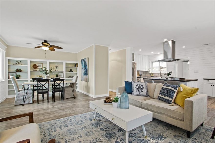Welcome to this beautifully updated 3-bedroom, 2-bathroom home with a spacious two-car garage, in the Artcraft Manor area! Step into a bright and inviting space featuring recessed lighting, an upgraded kitchen and bathrooms, double-pane windows, and a formal dining room that seamlessly flows into the cozy living room, complete with a gas log fireplace for added warmth and ambiance. The kitchen boasts granite countertops and ample cabinetry for generous storage, along with pull-out shelves in the pantry for added convenience. The master bedroom features a fireplace heater, providing comfort and ease. Enjoy year-round climate control with central heating and A/C. The front and backyard feature a sprinkler system, making lawn care effortless. The private backyard offers a peaceful retreat—perfect for relaxing or entertaining. The attached two-car garage provides extra storage and convenience, making daily life effortless. Located in a quiet and welcoming neighborhood, you’ll love being just minutes from top-rated schools, local colleges, beaches, PCH, restaurants, shopping centers, and major freeways. Don’t miss out on this incredible opportunity!