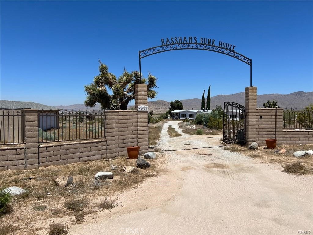 ZONING DELAYS HAVE BEEN CLARIFIED. Two Manufactured Homes, Attached And Bolted To A The Foundation, Attached And Connected By A Breezeway Creating One Large Spacious Home On Over 4 Acres of Usable Land. 4 Spacious Bedrooms, 4 Spacious Baths, Two Fireplaces, Two Spacious Kitchens Providing Room For Two Families Or In-Law Quarters. In-Ground Fenced Pool, Working Well Has Been Updated, Two Septic Tanks By Main Home And One On The West Side OF The Property To Accommodate A Future Build, 3 Tanks Total, The Entire Property Is Fenced And Off The Beaten Path. Being Sold As A Fixer, As Is.
Seller May Consider, Short Term Carry-Back Financing With 30% or more down payment.