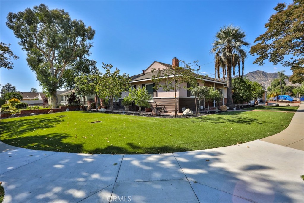 This beautiful North Azusa home is a must-see for buyers seeking over 2,100 square feet of living space on a generously sized lot.
As you enter through the front door, you’ll immediately notice the rich wall-to-wall hardwood flooring and the open, functional floor plan that makes this home so inviting. The entire property has been tastefully upgraded, with a strong emphasis on quality and modern convenience.
The remodeled kitchen features soft-closing cabinets and drawers, granite countertops, a deep ceramic sink, recessed lighting, and stainless steel appliances.
Also on the first level, down the hallway on the opposite side of the home, you'll find three well-sized bedrooms, a fully upgraded bathroom, and a ¾ bathroom attached to one of the bedrooms—perfect for guests or extended family.
Upstairs, the second level can be used as a luxurious primary suite, complete with a walk-in closet and a remodeled bathroom offering dual sinks, a soaking tub, and a separate shower. From this room, enjoy stunning mountain views.
Additional upgrades include a newer tankless water heater a newer A/C unit recently installed. Full home water softening system and drinking water filtration system. This home is ideally located within walking distance to the beautiful park, 3 elementary schools, just minutes from shopping and dining options in vibrant downtown Azusa.
