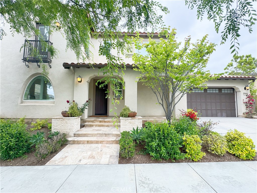 It's a beautiful partially furnished home in The Great Park. The gorgeous Spanish architecture , preferred south facing direction and lush front & back yards make this property well impressed from outside. Fabulous floor plan offers 4 bedrooms and 4 full bathrooms include 1 private suite downstairs with its own entry, living room, kitchenette and laundry which is perfect for extend family & friend or tenant. Gourmet kitchen has a large Center Island, brown cabinetry, and stainless steel appliances.Hardwood floor covers entire downstairs. One may enjoy with other features like plantation shutter, solar system and much more to discover. Two bedrooms upstairs. Spacious Master Suite features his & her closets, sinks and a walk-in shower. Separate Laundry room. Direct access 2-car garage. Community amenities include a swimming pool, spa, picnic area, playground, and tennis courts. Convenient to shopping, restaurants, Woodbury Shopping Center, the famous Orange County Great Park and Irvine Spectrum.