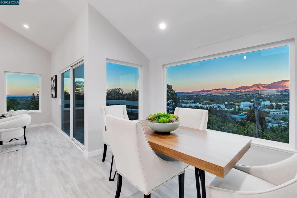 A must-see hillside retreat blending modern comfort with breathtaking views. This updated two story, 3 bed, 2 bath townhouse is perched above Walnut Creek with sweeping views of Mt. Diablo. Light-filled interiors feature open living spaces and automated skylights that fill the home with natural light. The kitchen offers stainless steel appliances, sleek cabinetry, and generous counter space, flowing into the dining and living areas for easy entertaining. Expansive windows frame the scenery, while two private balconies provide the perfect spots for morning coffee or evening sunsets. Ideally located just minutes from downtown Walnut Creek, BART, shopping, dining, schools, and outdoor recreation, this home combines hillside tranquility with everyday convenience. Views: Downtown