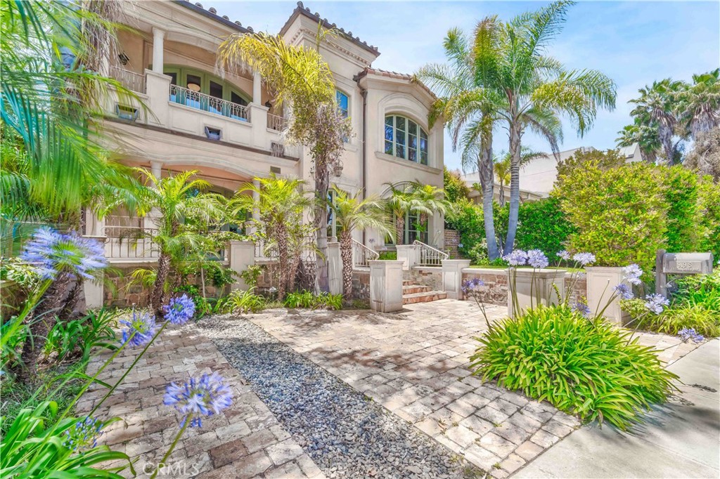 Spanish Colonial Revival Masterpiece in Prime Brentwood. An architectural triumph of timeless elegance and refined craftsmanship, this Spanish Colonial Revival estate embodies the pinnacle of style and design in one of Brentwood’s most coveted locations. Meticulously curated with an extraordinary attention to detail, this home offers a seamless blend of classic sophistication and modern luxury. Step into grand living spaces including a formal library, an elegant formal dining room, and a warm family room—each adorned with one of four stately fireplaces. The chef’s dream kitchen is a culinary showpiece, complete with a generous breakfast room, perfect for effortless entertaining or intimate mornings. The stunning primary suite is a true sanctuary, featuring two private retreat areas and a spa-caliber bathroom with a steam shower, evoking the ambiance of a luxury resort. Enjoy sweeping city views from the private sundeck, a serene escape perched above the city. Additional highlights include: – Separate guest quarters/game room with fireplace and full bath – Four zones of air conditioning for optimal comfort – Brazilian walnut floors and hand-finished old-world style stone flooring – Exquisite custom woodwork throughout – Sheltered outdoor patio with fireplace and built-in BBQ—ideal for al fresco gatherings
– A rare offering of authentic character and exceptional quality in a premier Brentwood setting.